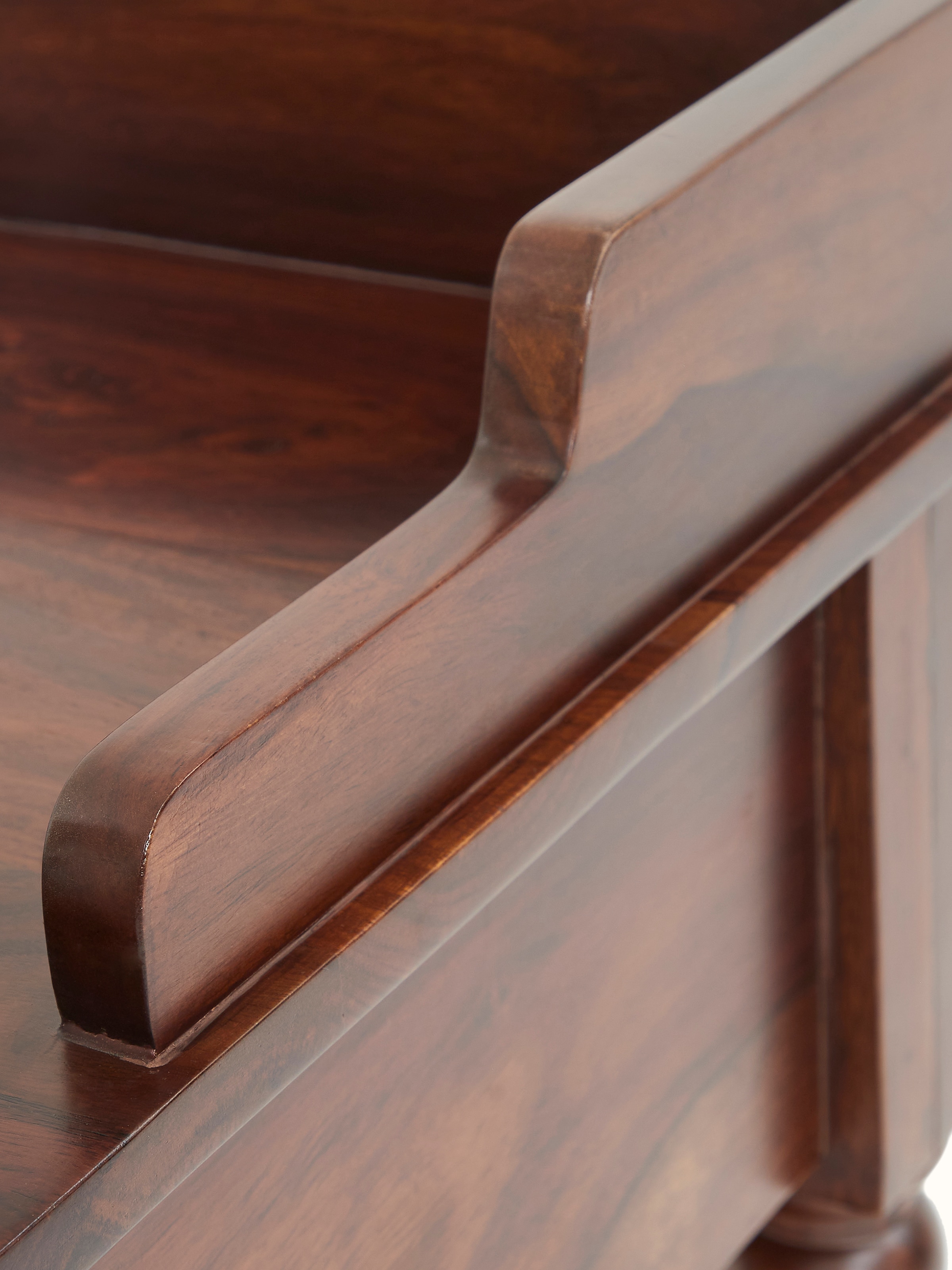 Close-up of the teak finish Sheesham wood bedside table’s drawer and handle, emphasizing the design and functionality.