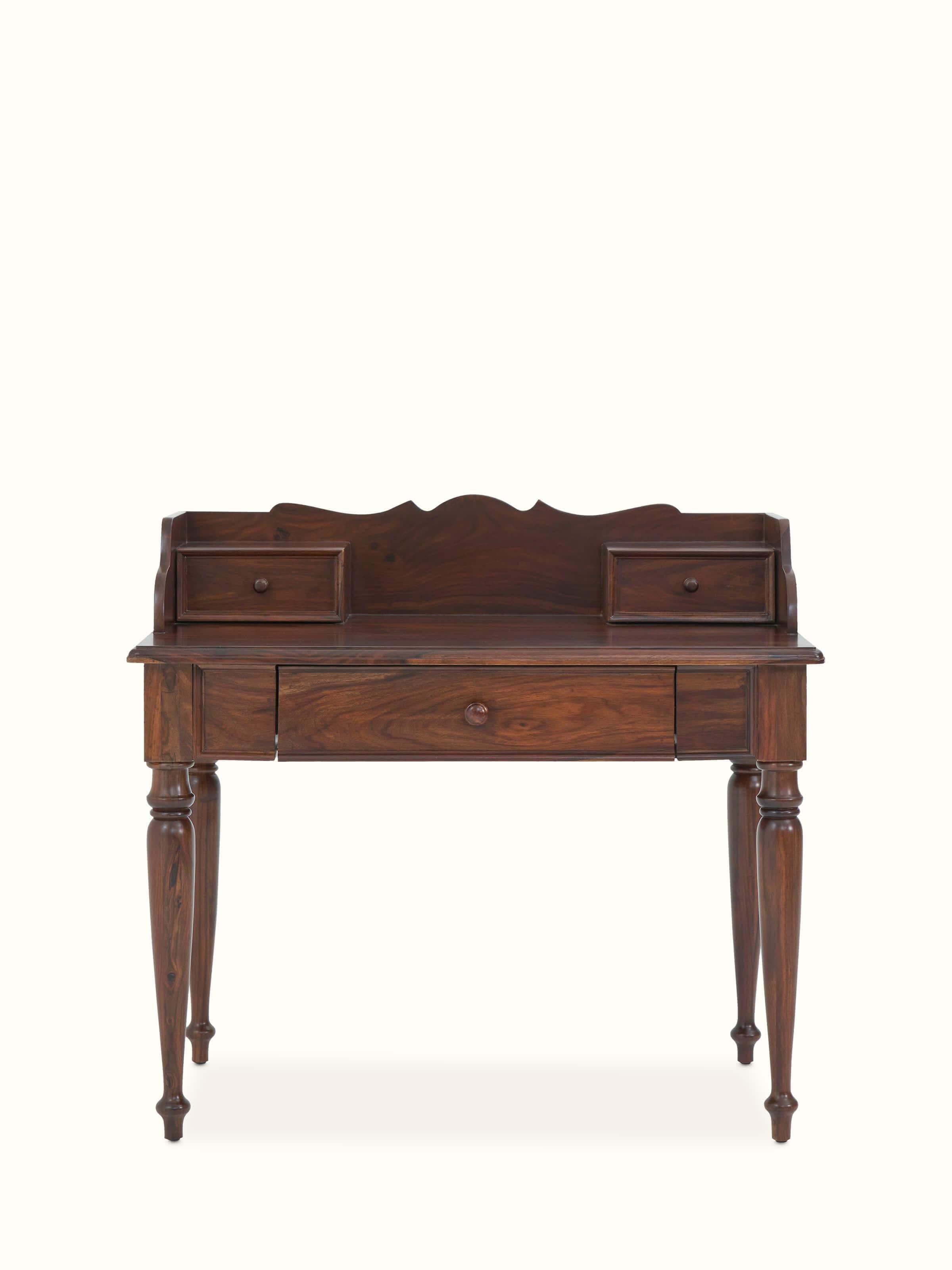 Front view of the Sheesham wood study table with three drawers, showcasing its clean lines and classic design