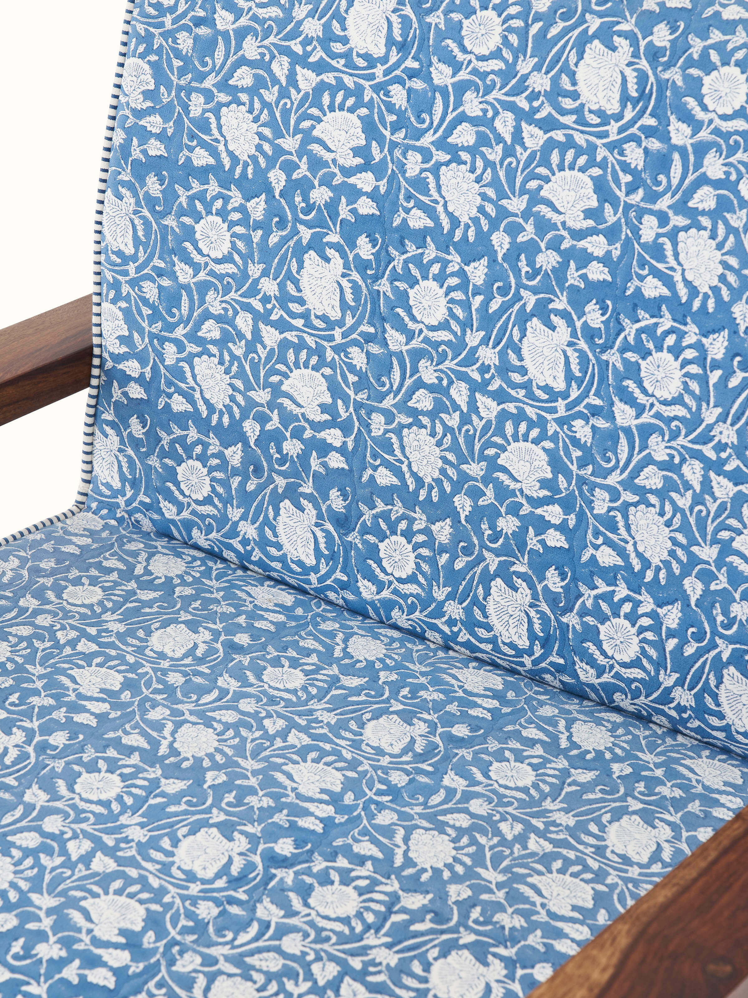 Back view of the Sheesham wood Sanganeri block print armchair, showcasing the upholstery and wooden frame details.