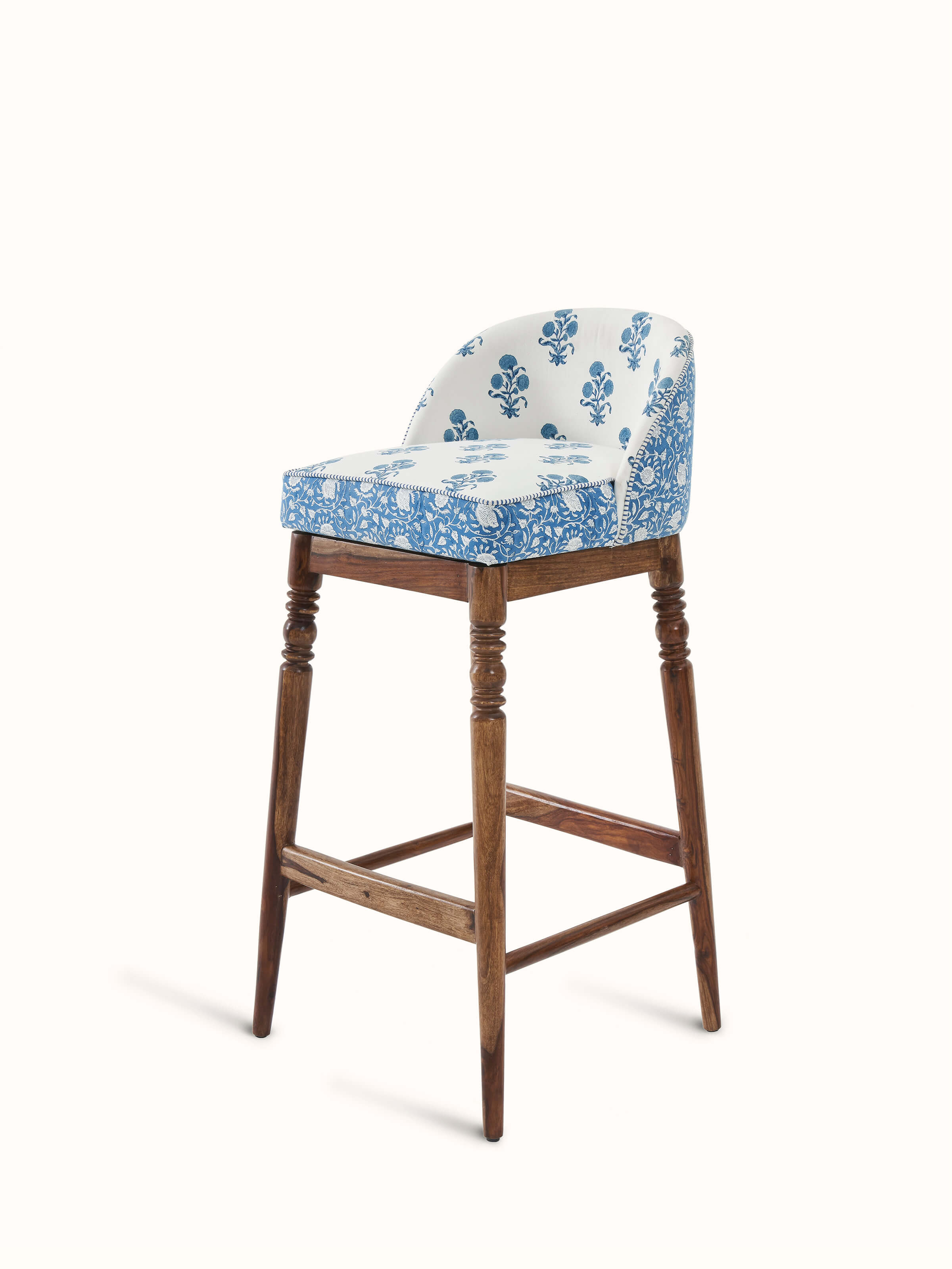 Close-up of Sheesham wood Sanganeri block print bar chair highlighting the rich wood grain and block print details