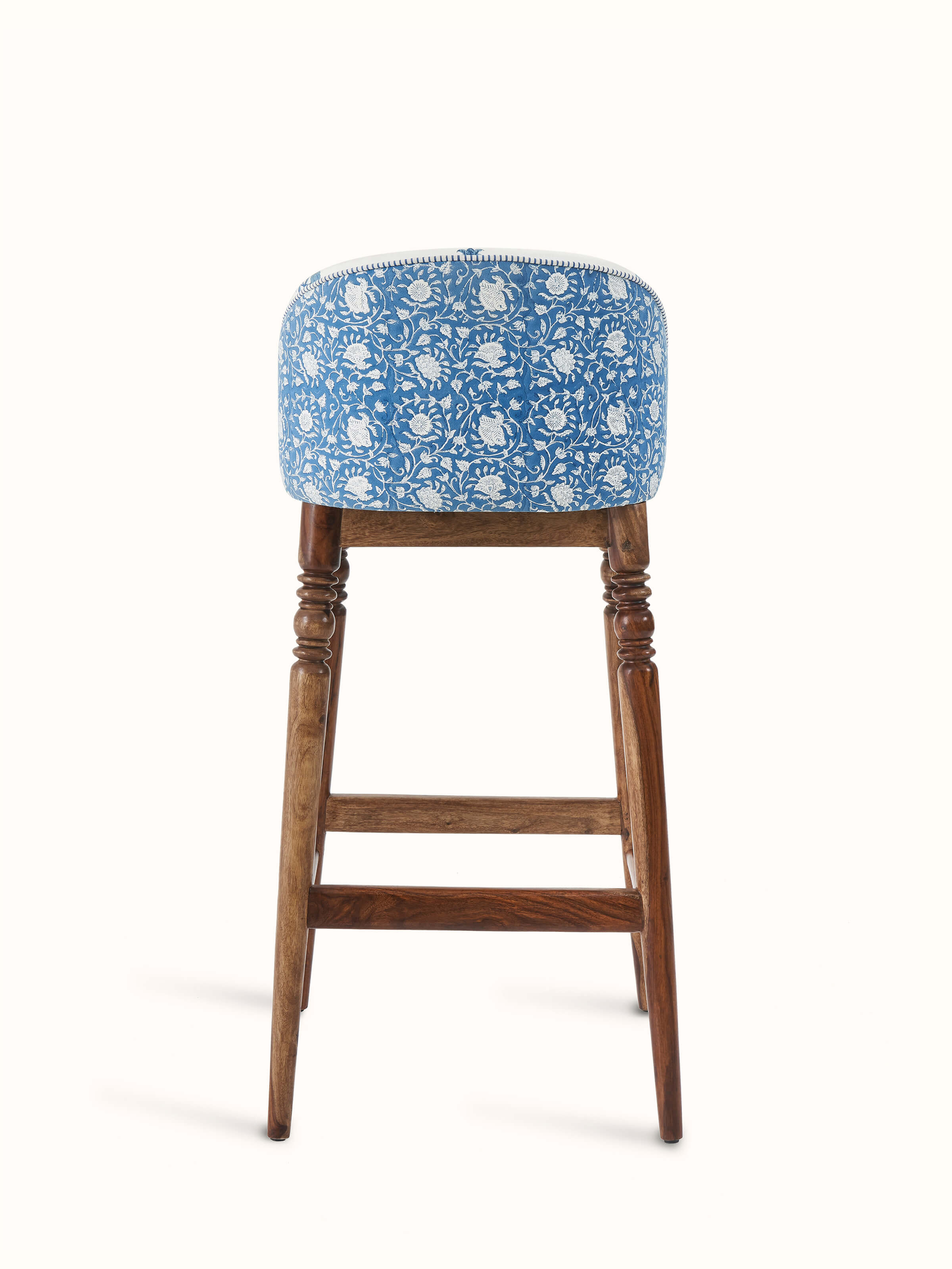 Side view of Sheesham wood Sanganeri block print bar chair showing the elegant block print pattern and traditional wood craftsmanship