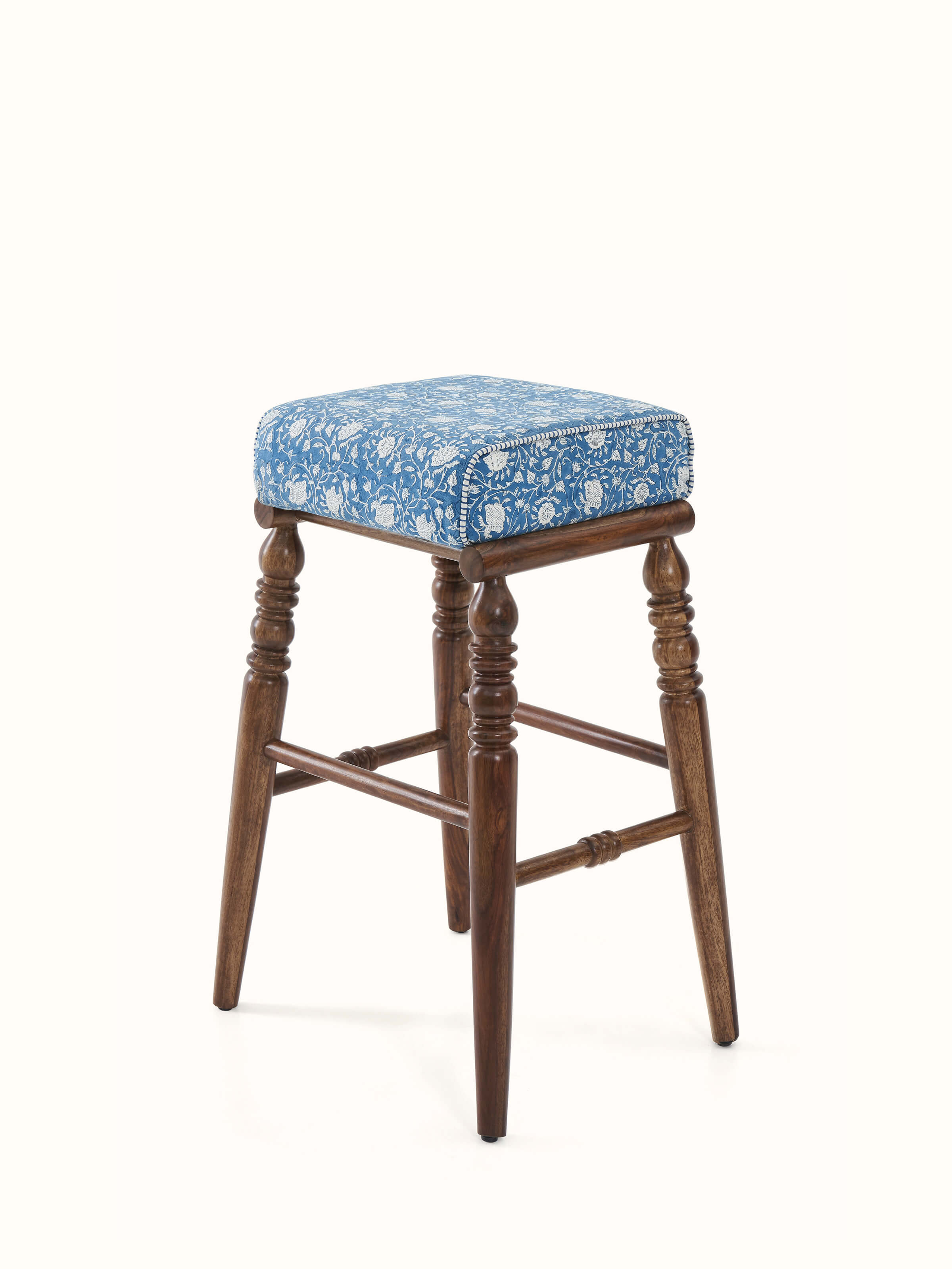 Close-up of the Sheesham wood bar stool with Sanganeri block print seat, emphasizing the intricate details and vibrant colors of the print.