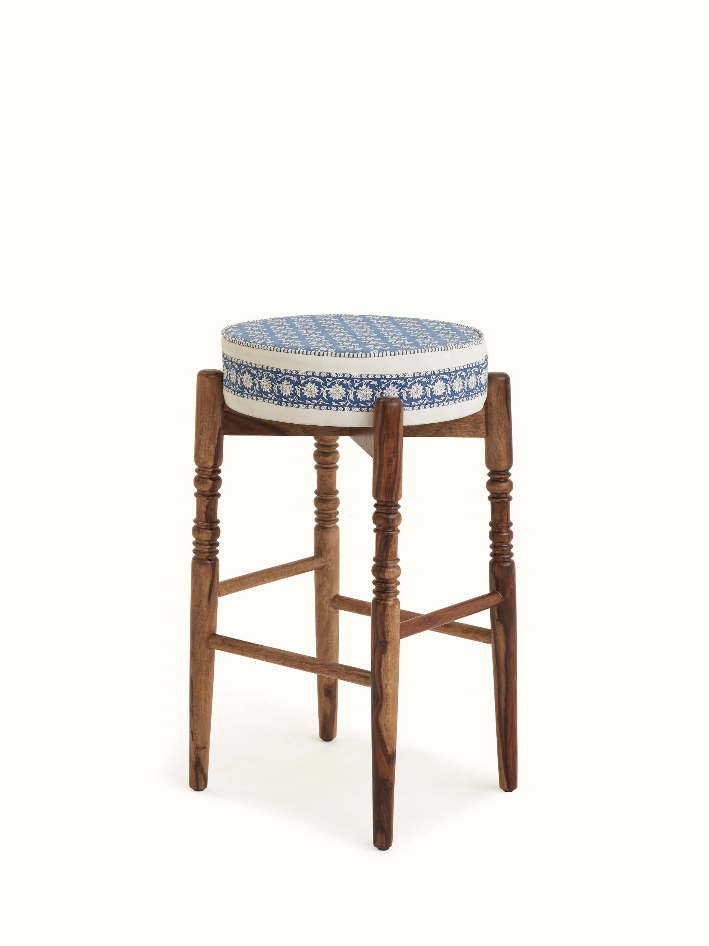Close-up of Sanganeri block print on Sheesham wood bar stool, showing the intricate patterns and craftsmanship.