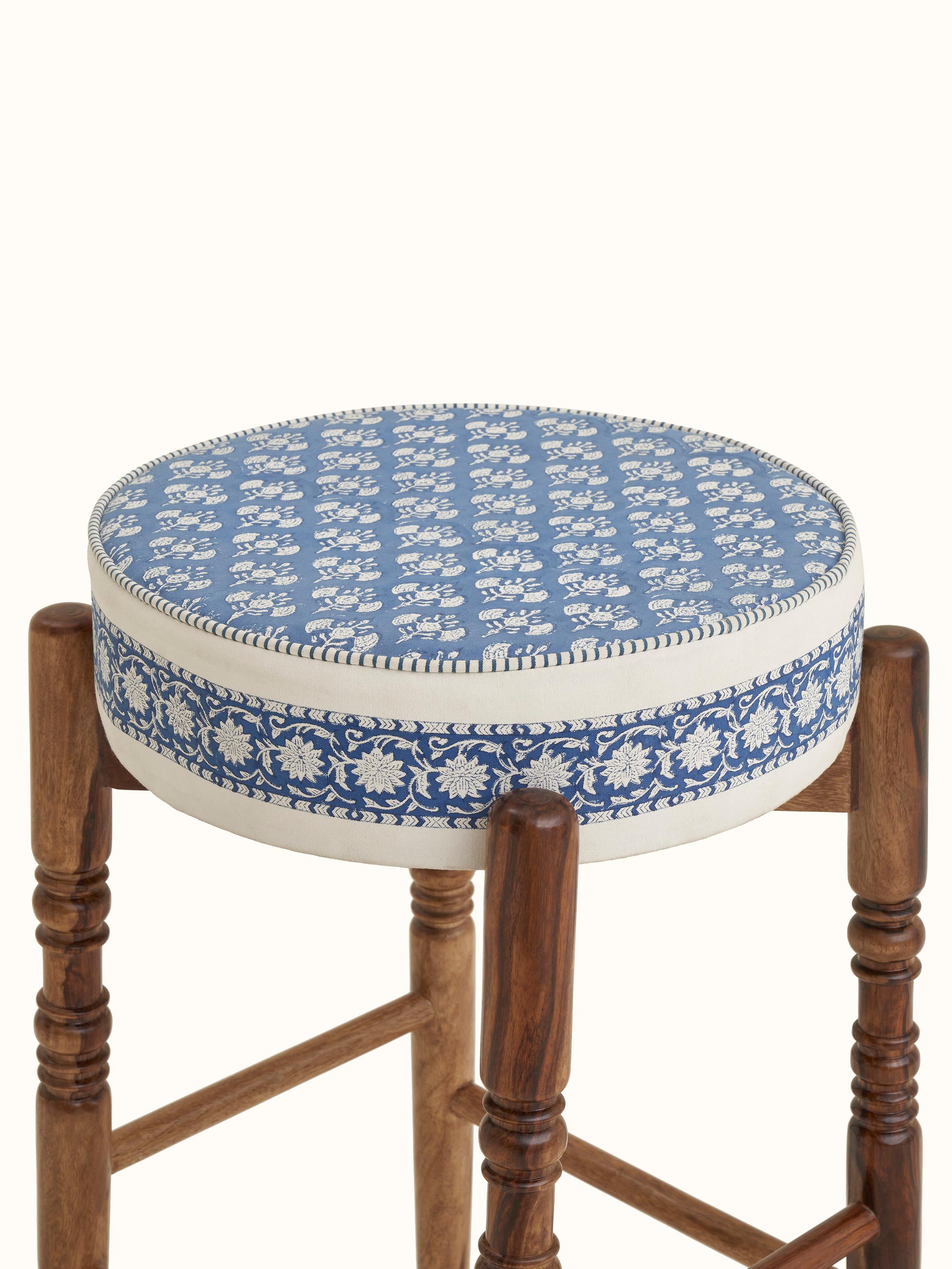 Detailed view of Sheesham wood legs of the bar stool, showcasing the sturdy construction and design elements.