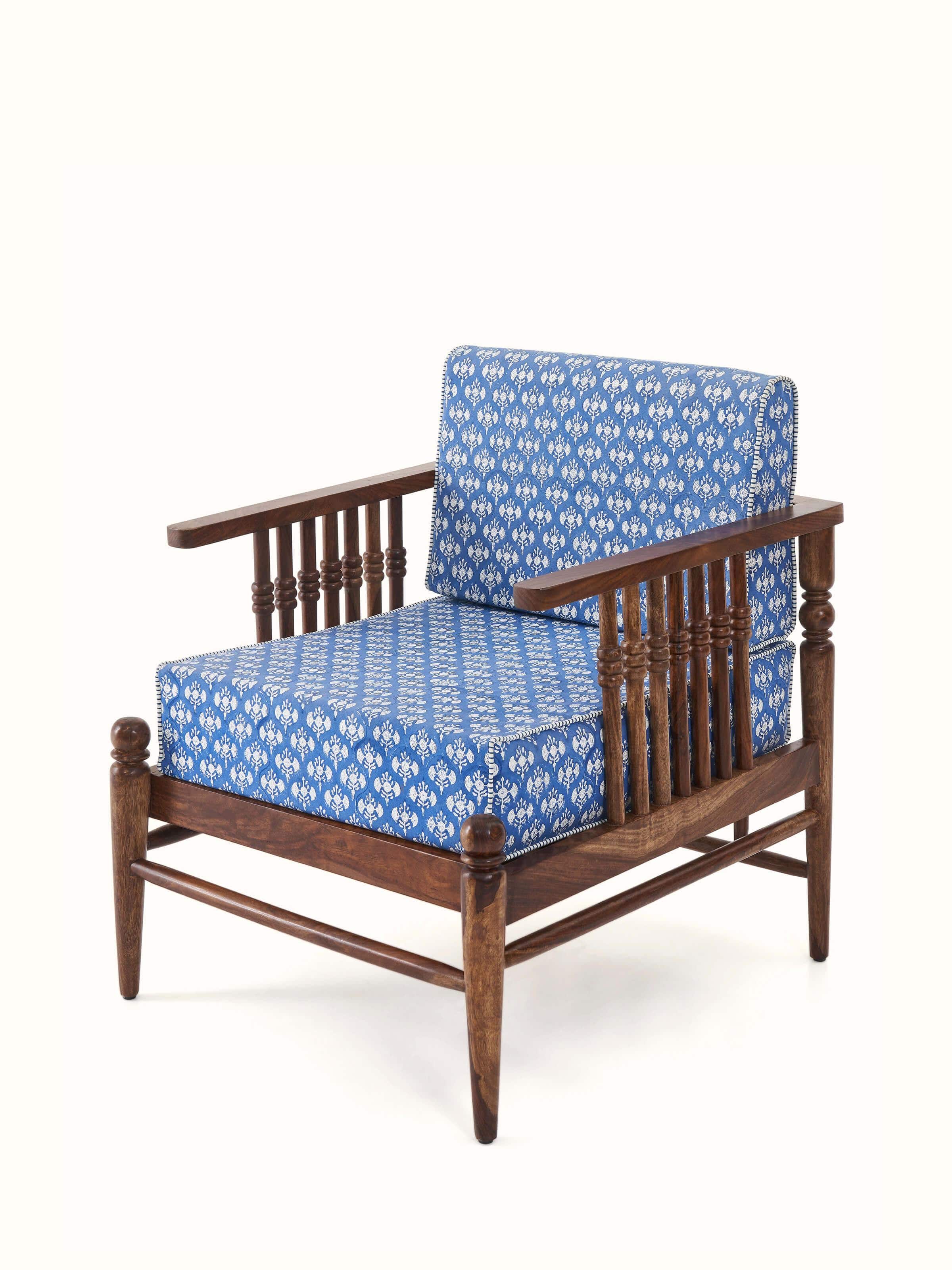 Angled view of Upholstered Sheesham Wood Sanganeri Block Print Lounge Chair highlighting its plush upholstery and sleek wooden frame.
