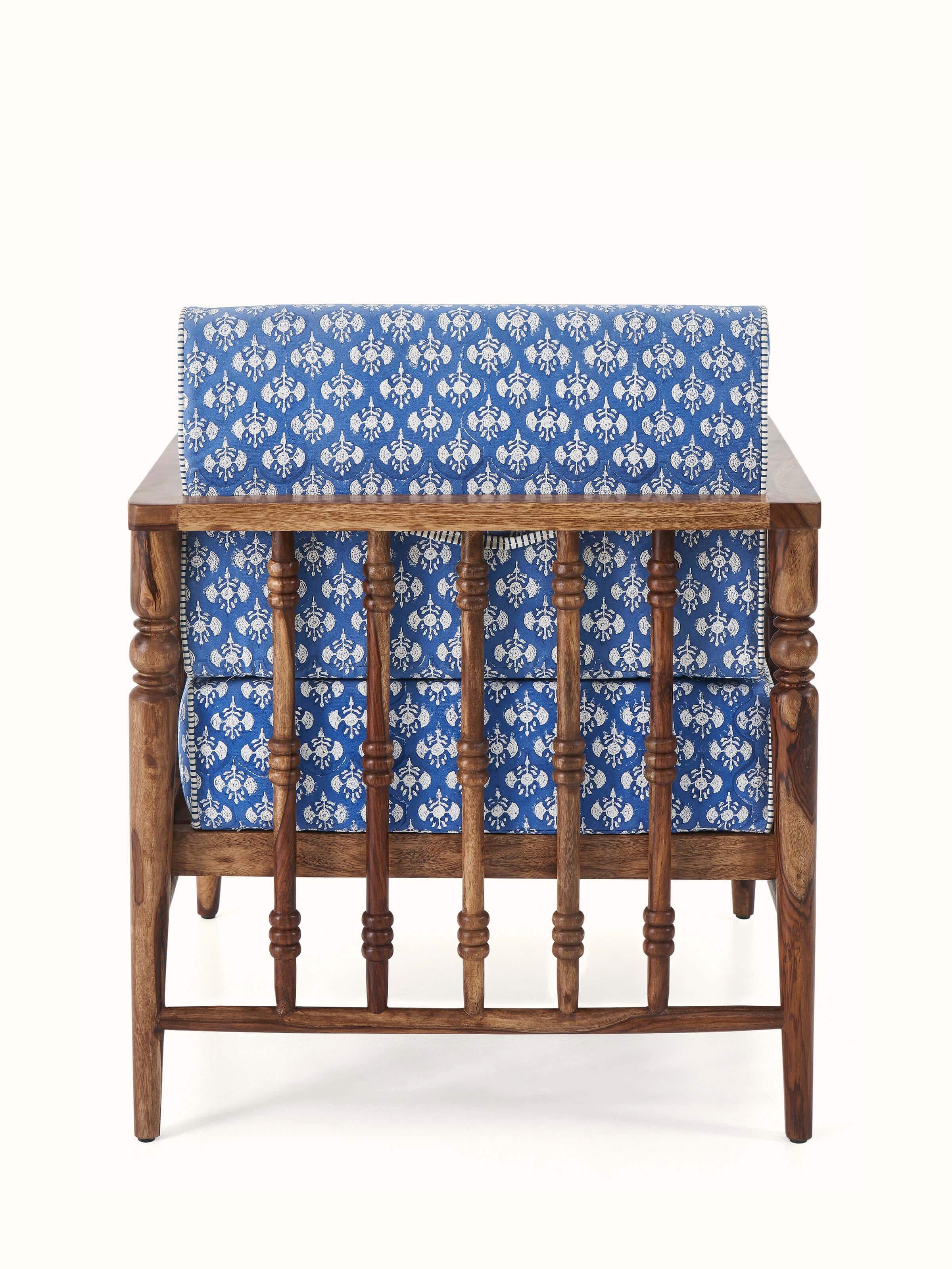 Side detail of Upholstered Sheesham Wood Sanganeri Block Print Lounge Chair showing its sleek, ergonomic design and comfortable armrests.