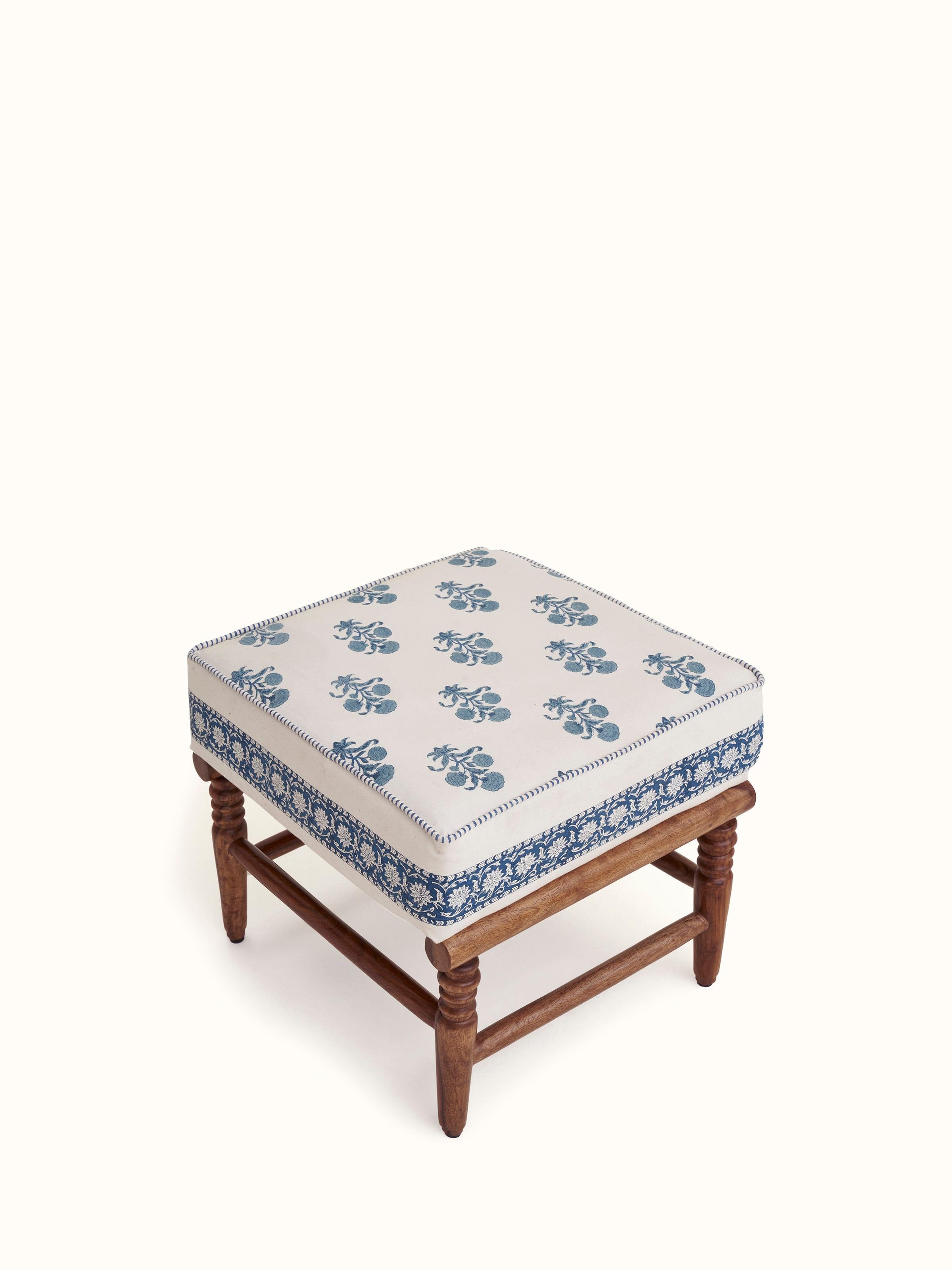 Angled view of the Sheesham wood Sanganeri block print ottoman, showcasing the artistic block print patterns and craftsmanship