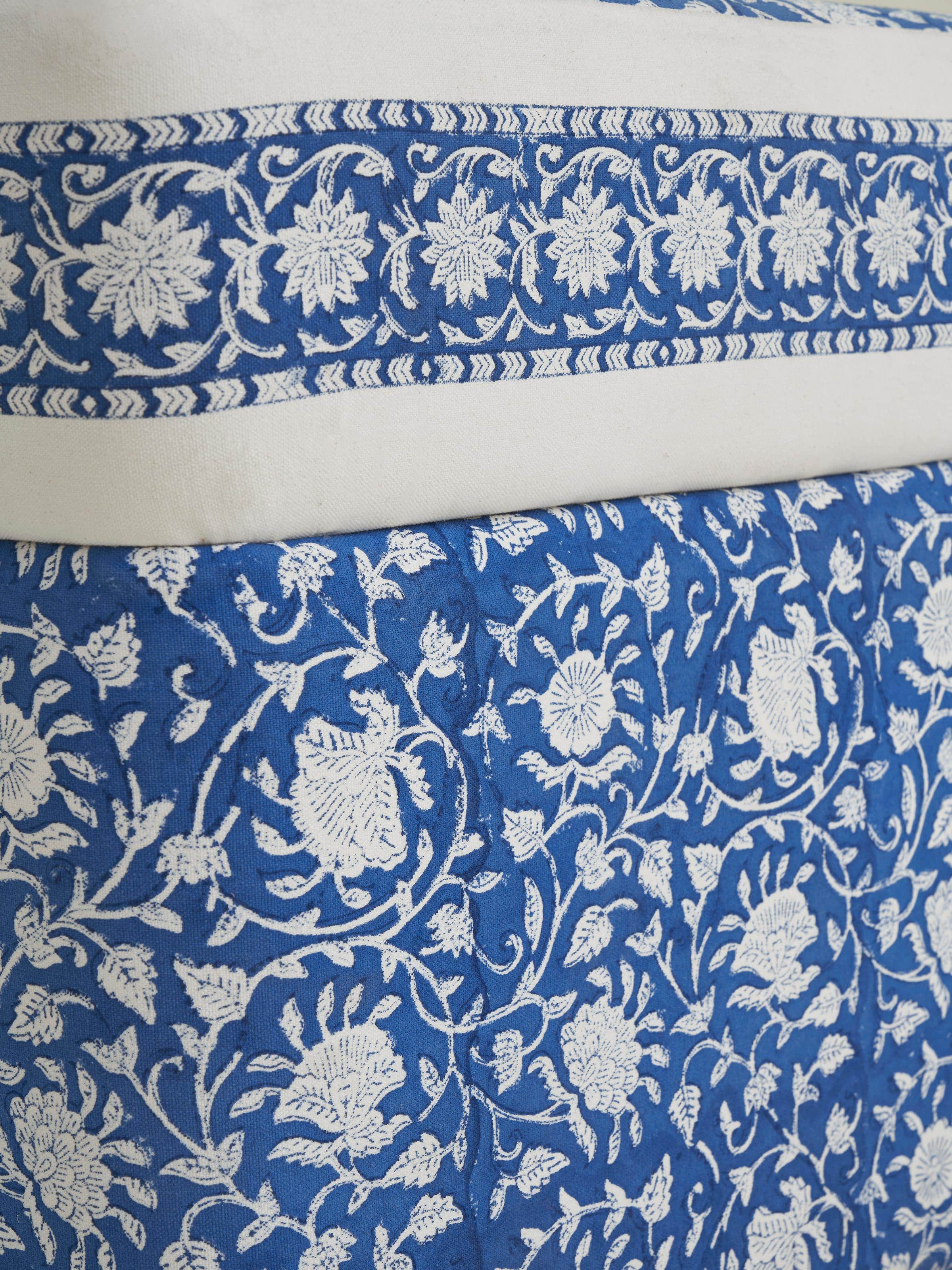 Angled view of Upholstered Sheesham Wood Sanganeri Block Print Pouffe, showing the blend of traditional block print and modern pouffe design