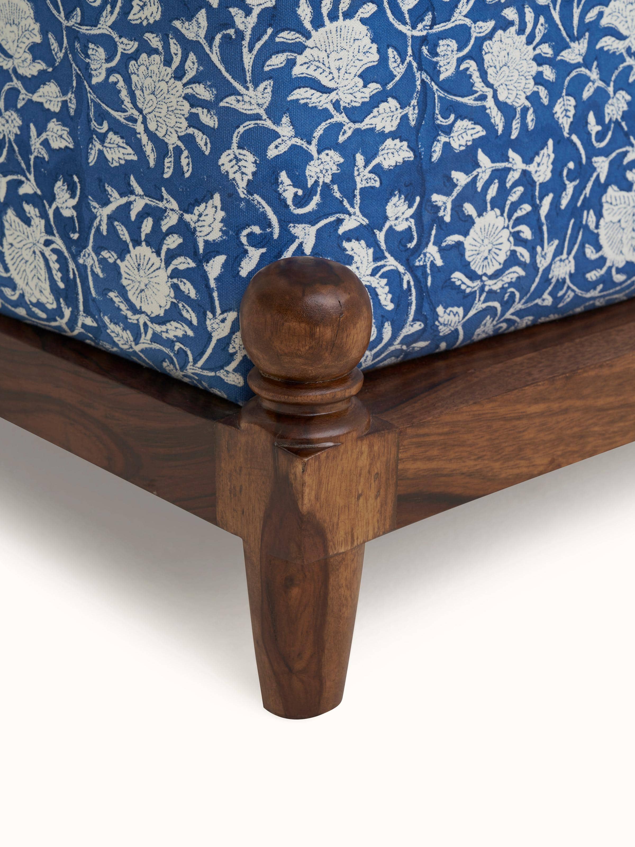 Detailed side view of Upholstered Sheesham Wood Sanganeri Block Print Pouffe, highlighting the quality of Sheesham wood and block print fabric