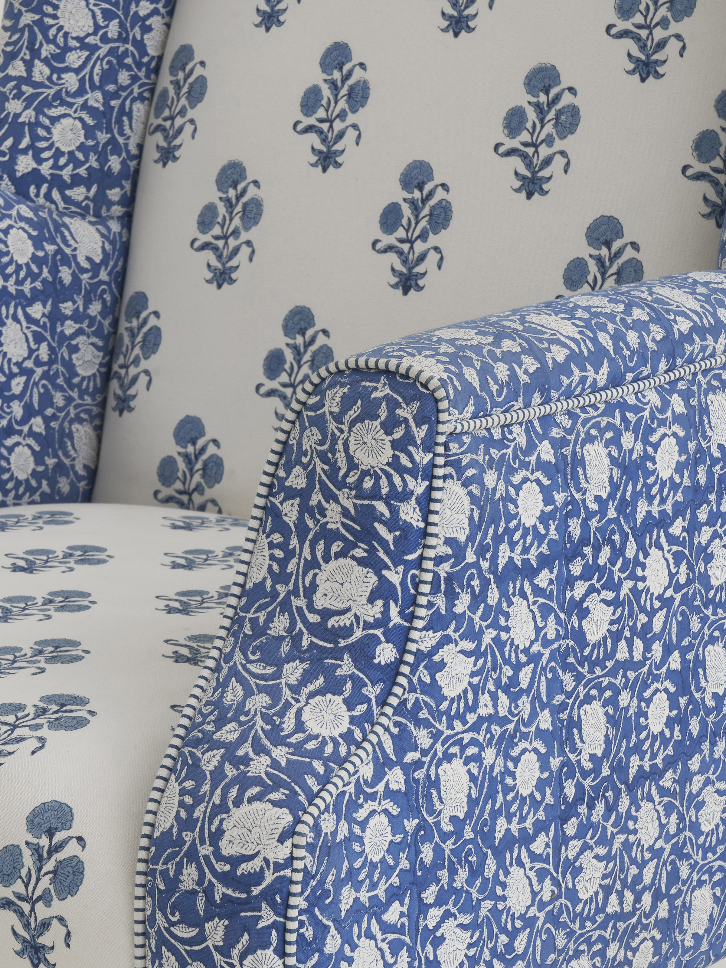 Another perspective of the upholstered Sheesham wood wing chair, highlighting the comfort and aesthetic appeal of the high back design