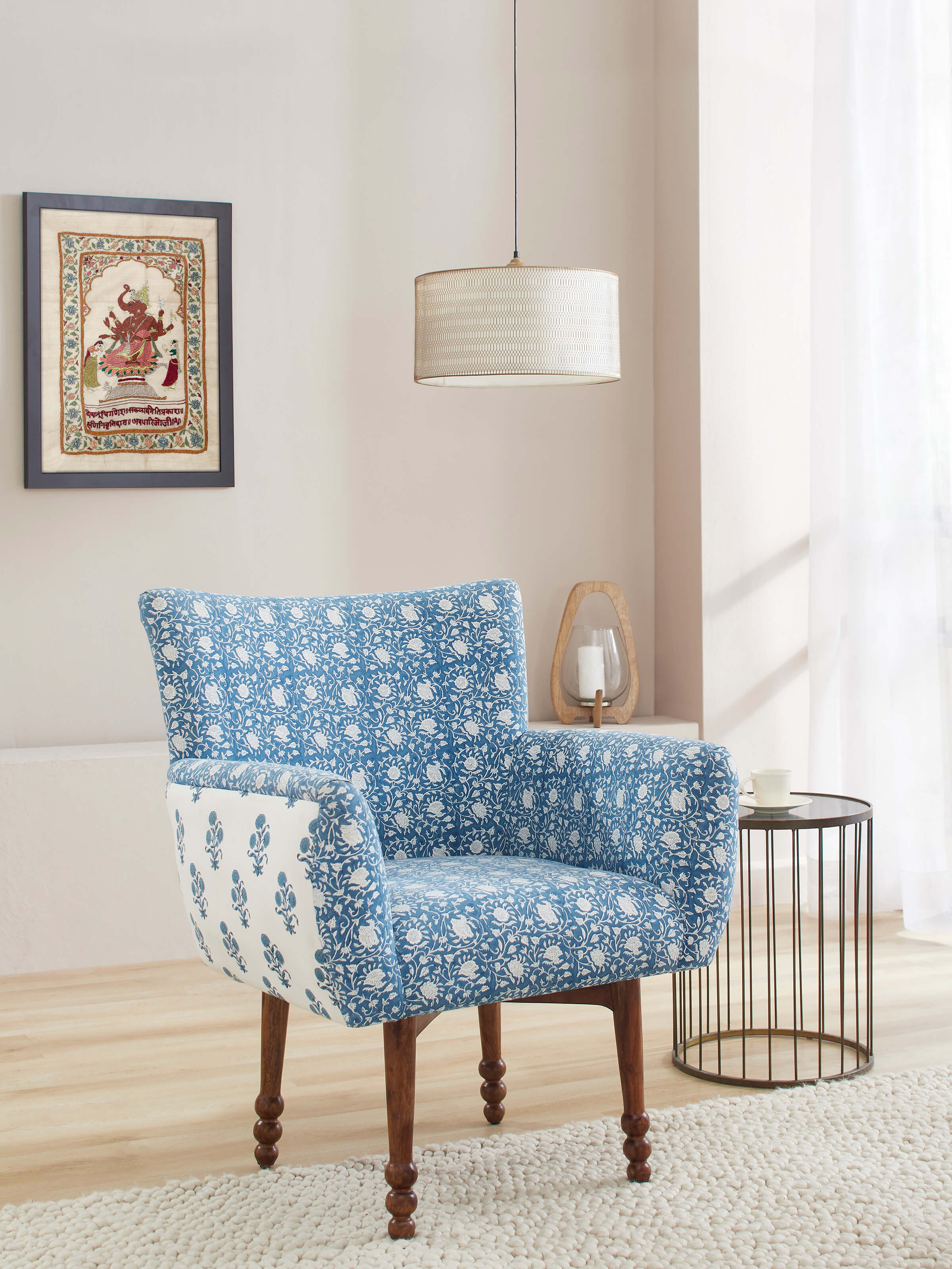 Side view of Upholstered Sheesham Wood Sanganeri Block Print Wing Chair, highlighting the chair’s profile and wooden frame