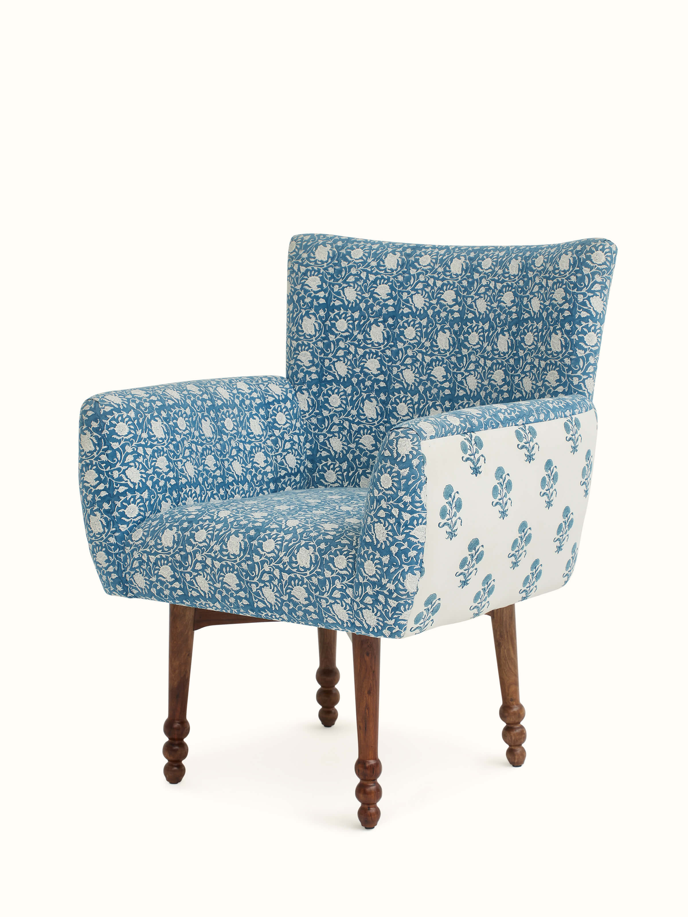 Close-up of Upholstered Sheesham Wood Sanganeri Block Print Wing Chair’s block print fabric, emphasizing the detailed design and texture