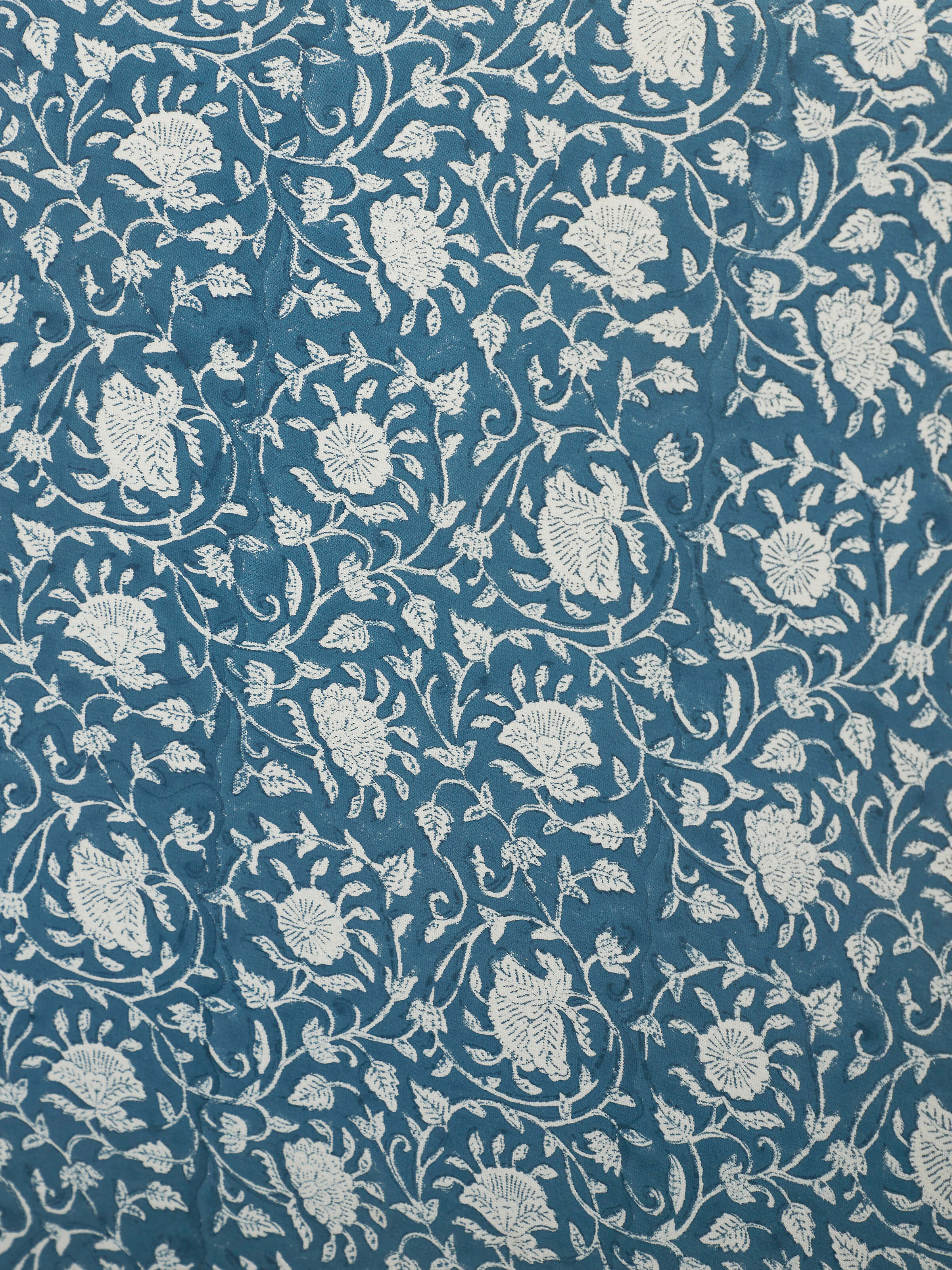 Angle view of Upholstered Sheesham Wood Sanganeri Block Print Wing Chair, displaying the rich wood finish and upholstery details