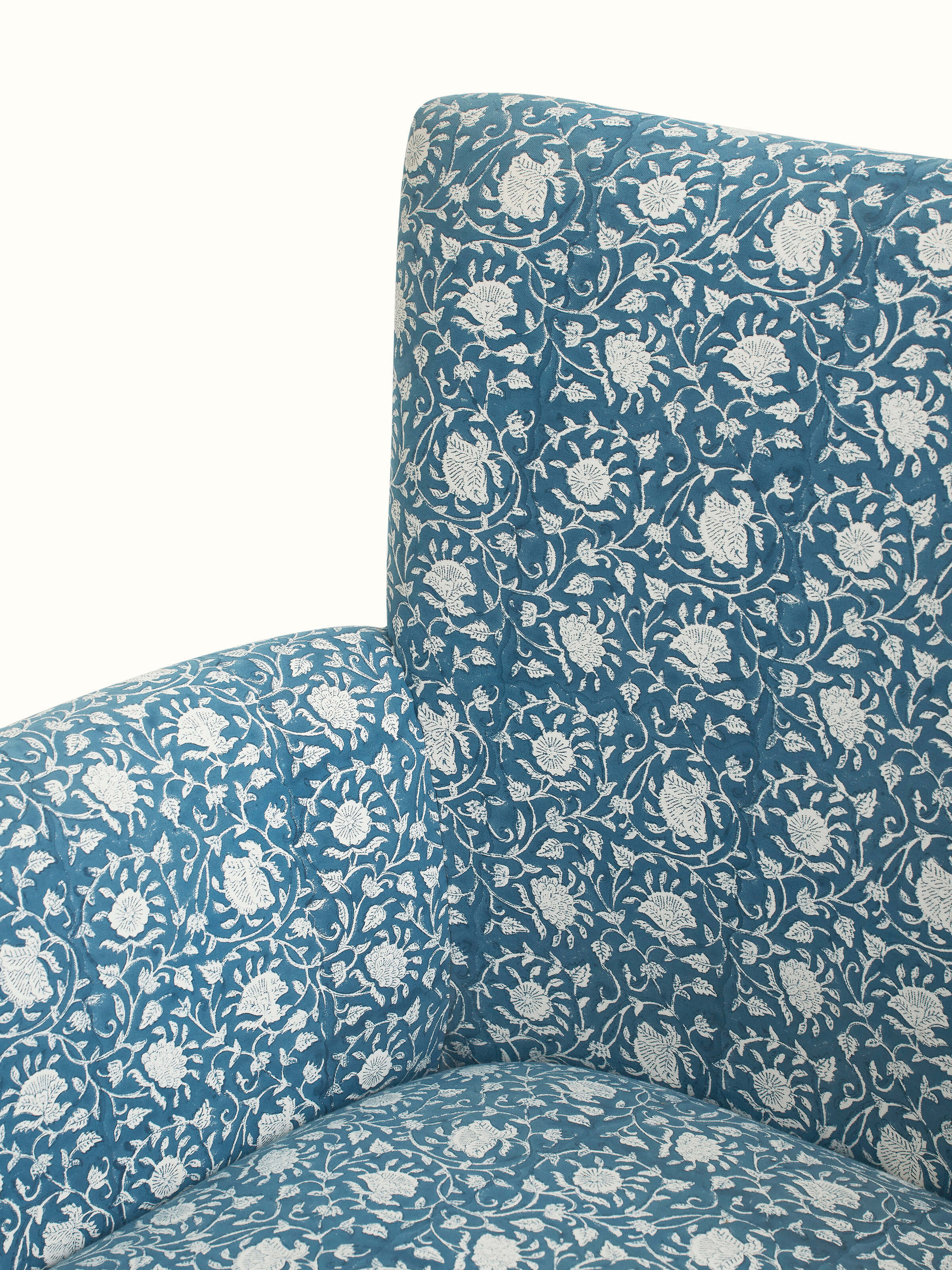 Detailed view of Upholstered Sheesham Wood Sanganeri Block Print Wing Chair’s backrest, showing the block print pattern and woodwork