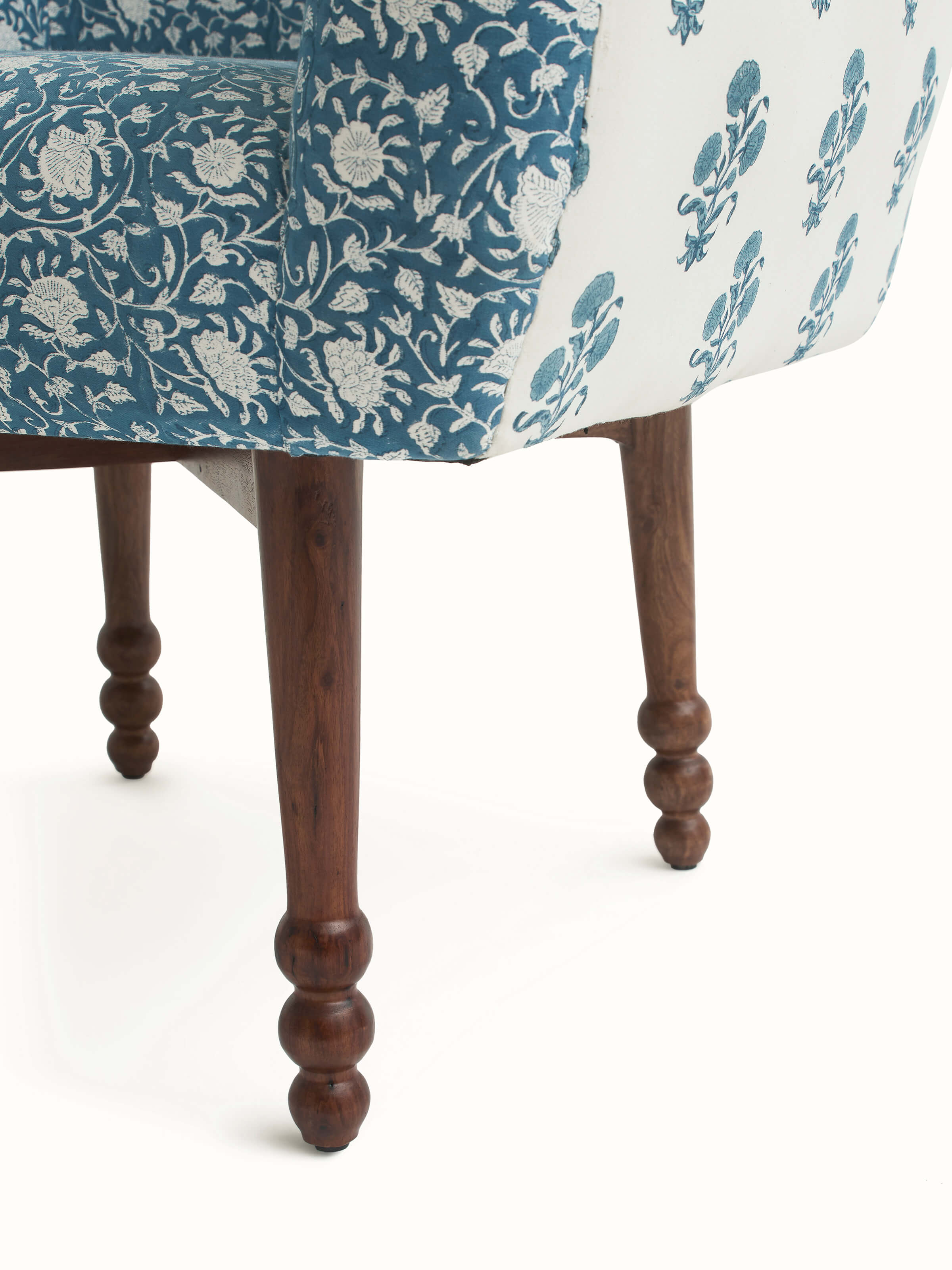 Overall view of Upholstered Sheesham Wood Sanganeri Block Print Wing Chair in a room setting, illustrating its style and placement