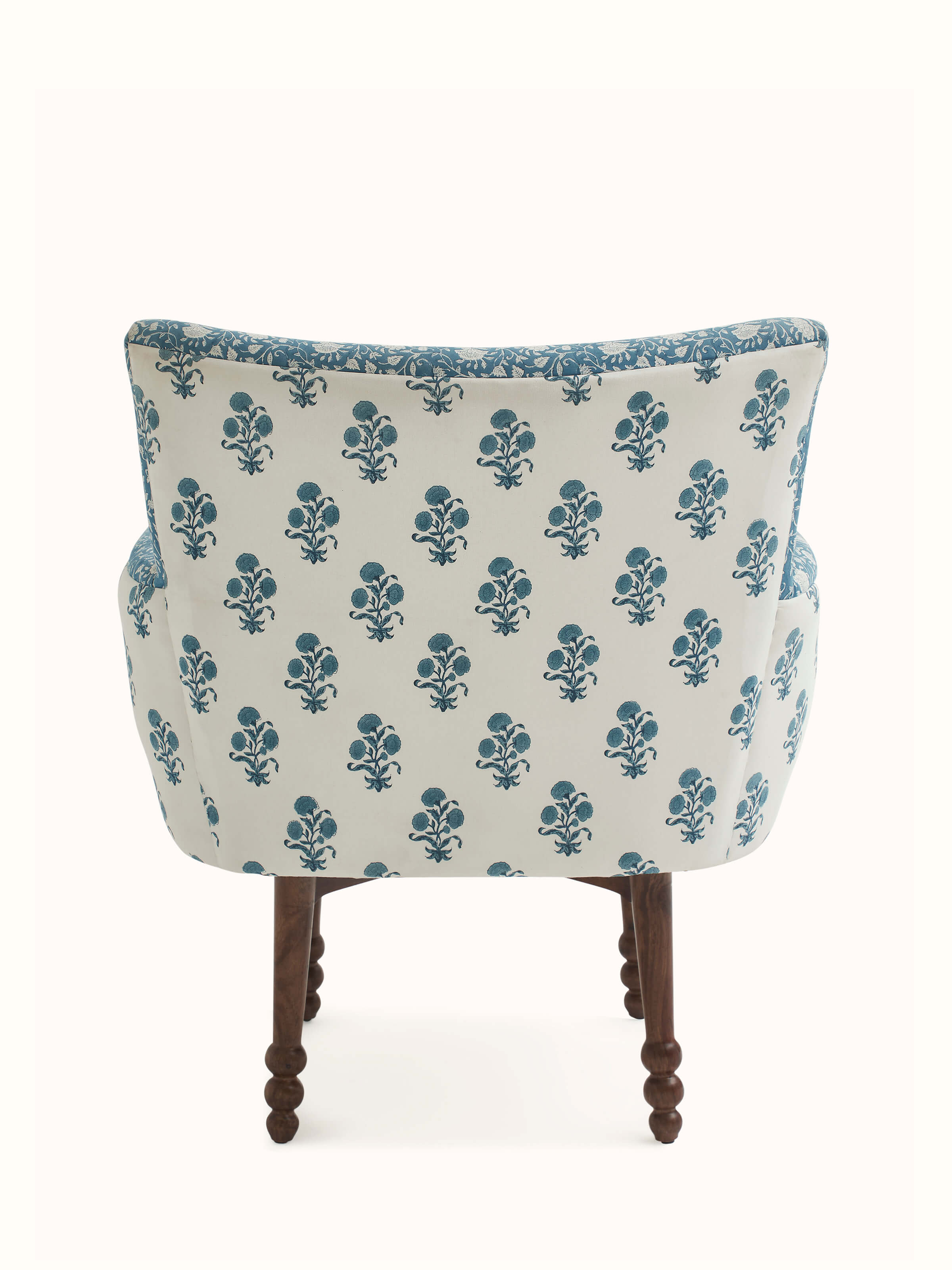 Close-up of the Sheesham wood details on Upholstered Sheesham Wood Sanganeri Block Print Wing Chair, focusing on the craftsmanship and finish