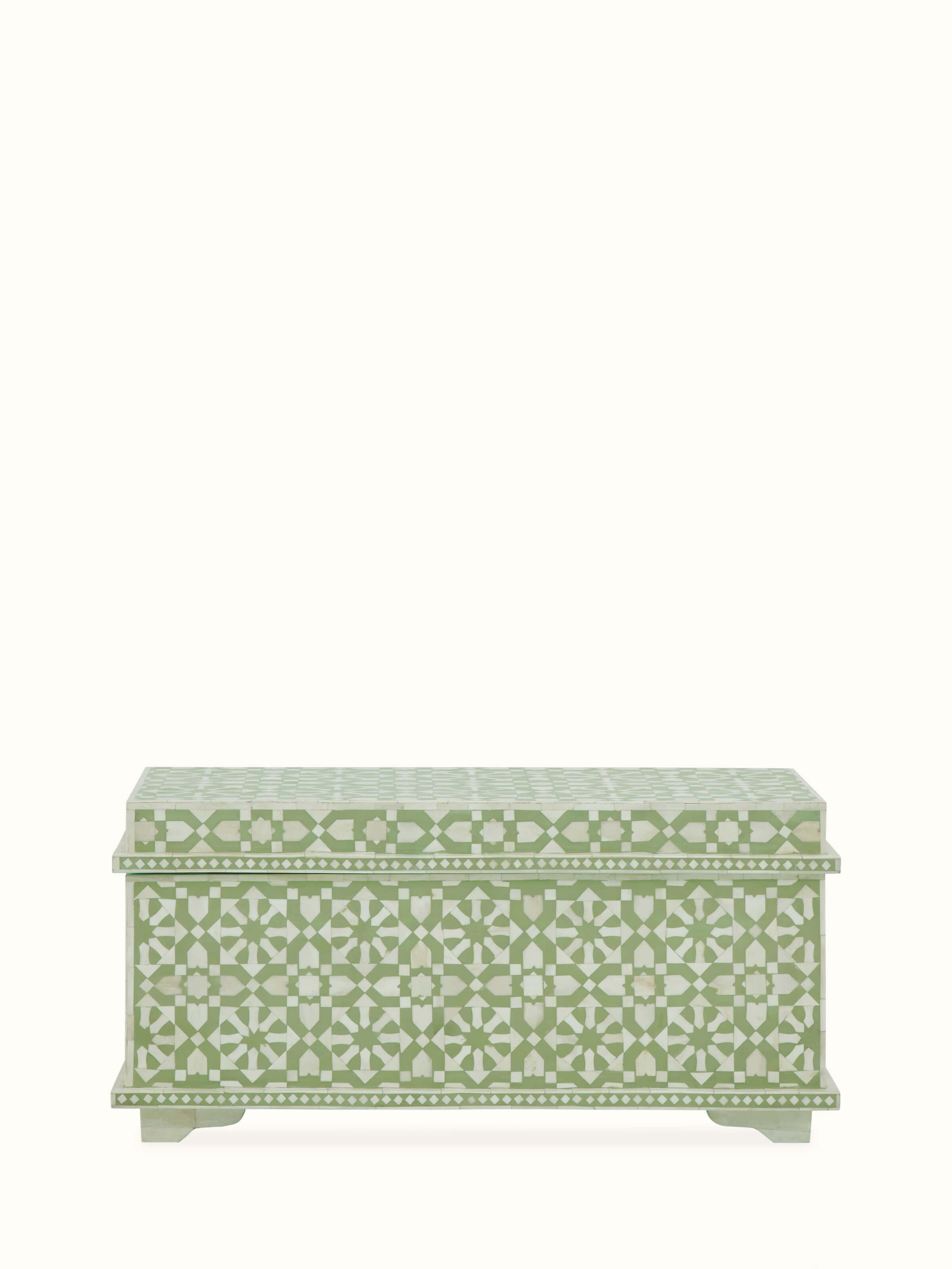 Front view of the bone inlaid trunk, showcasing the intricate bone inlay design and sturdy construction