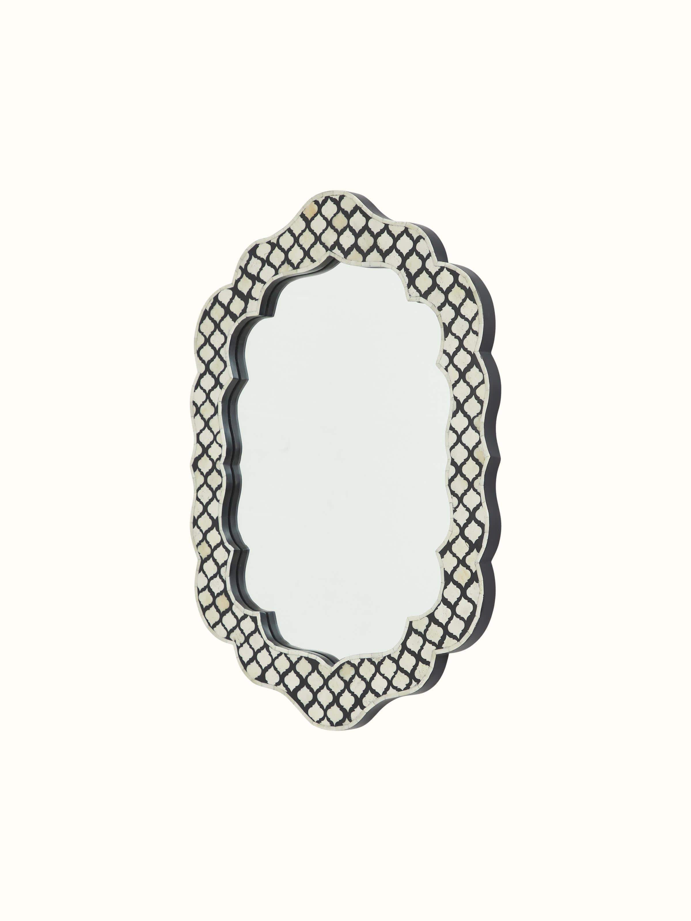 Close-up of bone inlaid design on the wall mirror, showcasing the fine craftsmanship and intricate details.