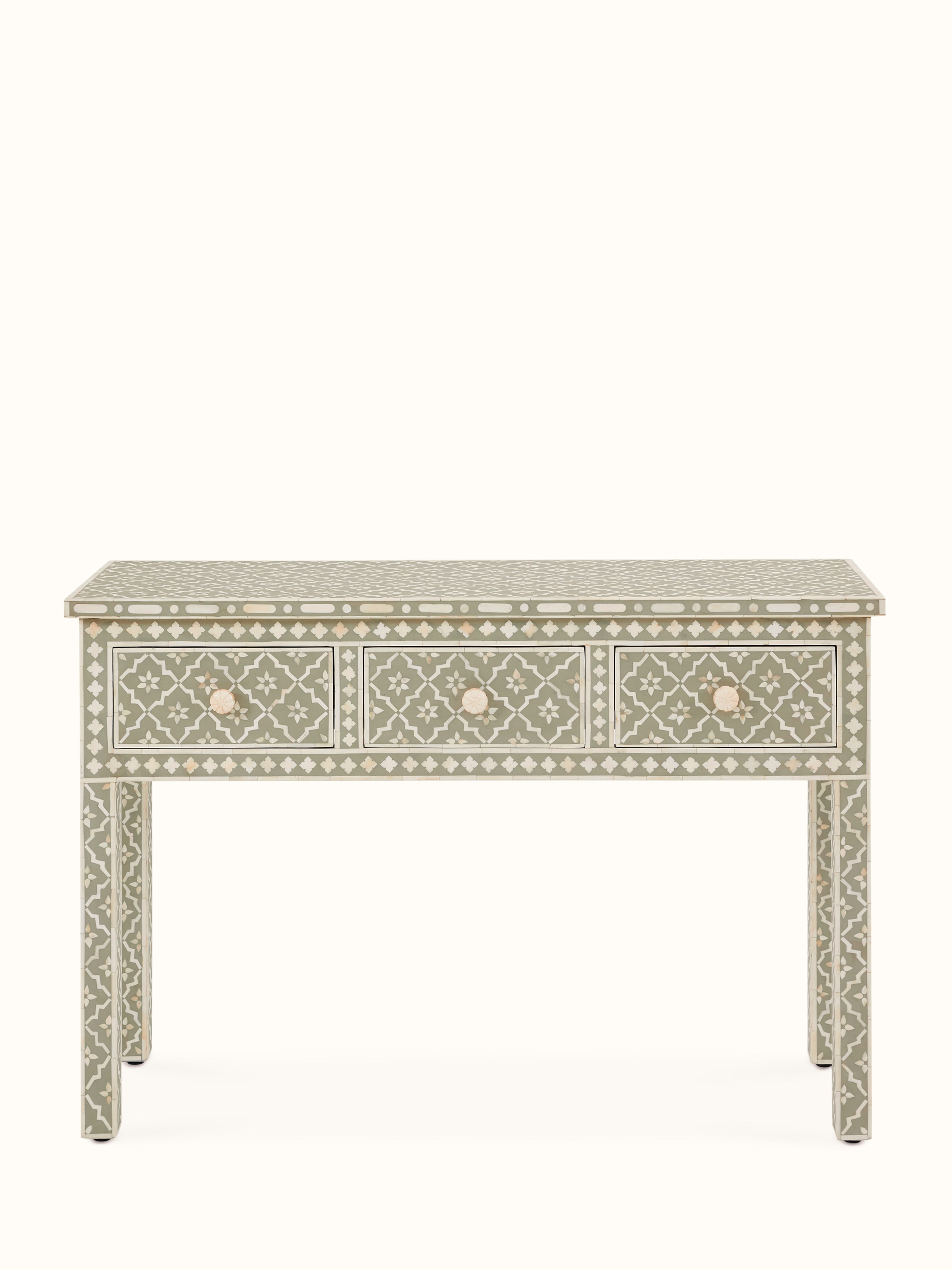 Front view of bone inlaid console table showcasing intricate design