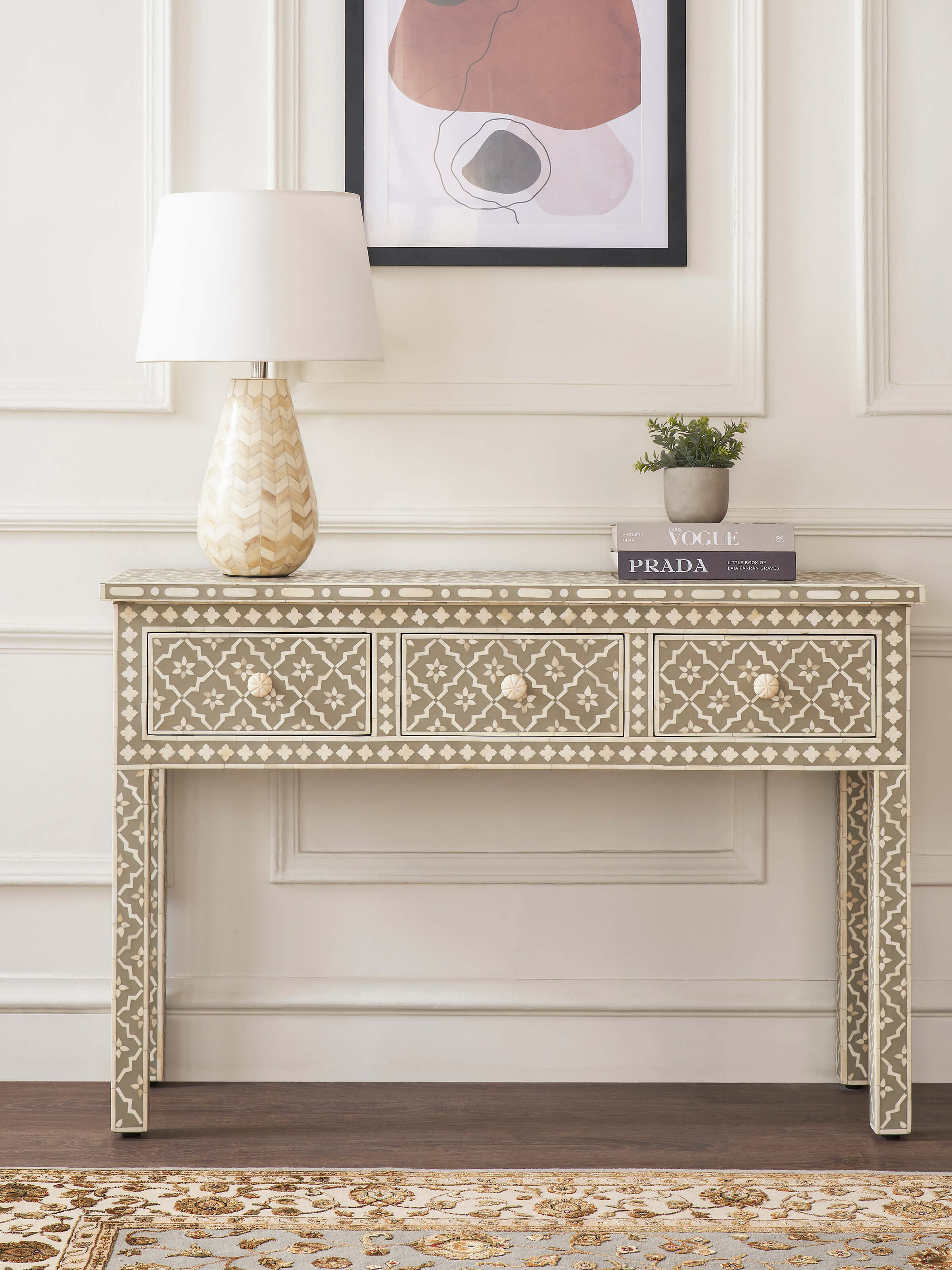 Side view of the bone inlaid console table highlighting the detailed inlay work