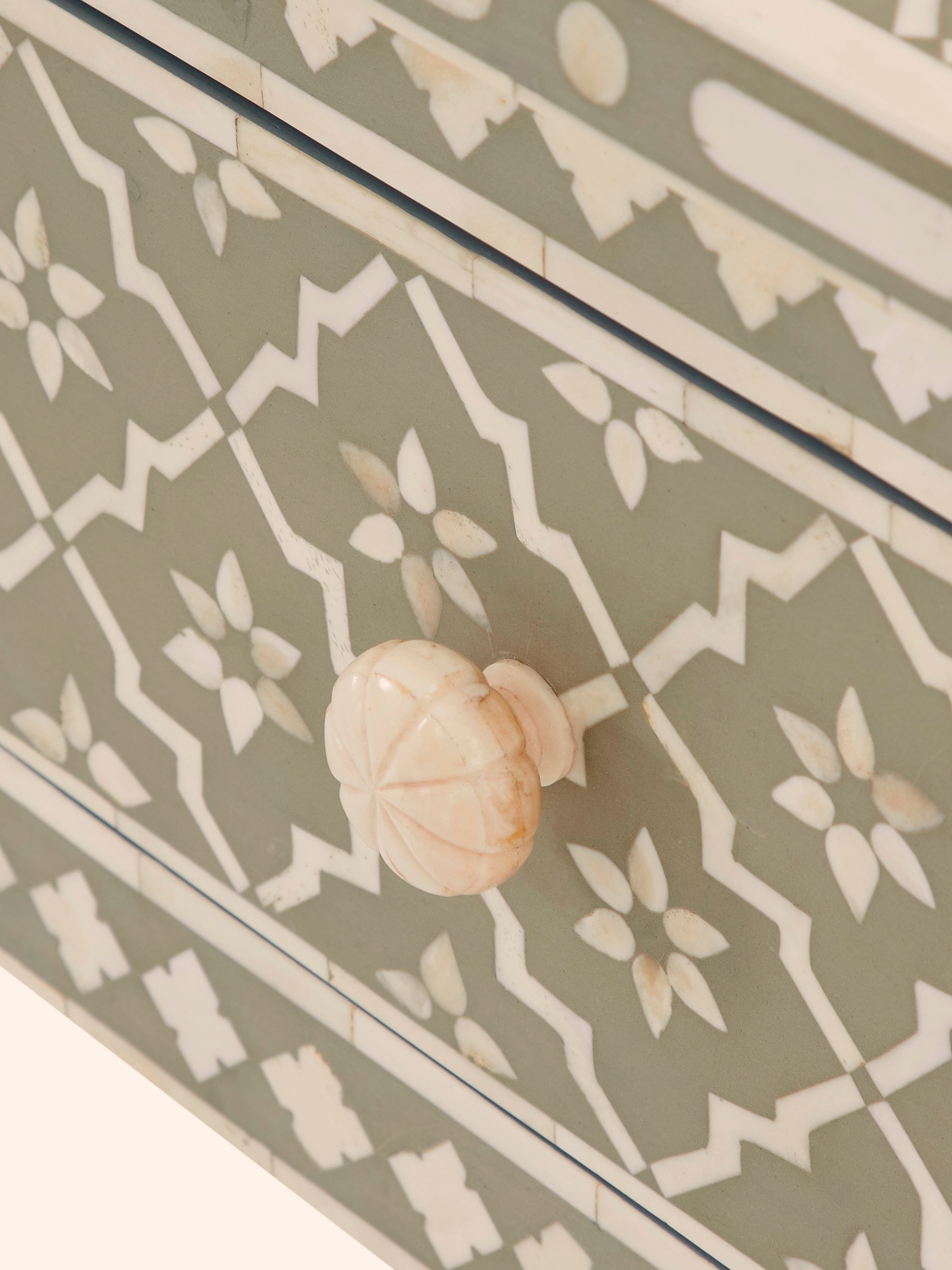 Angle view showcasing the overall design and bone inlay craftsmanship of the console table