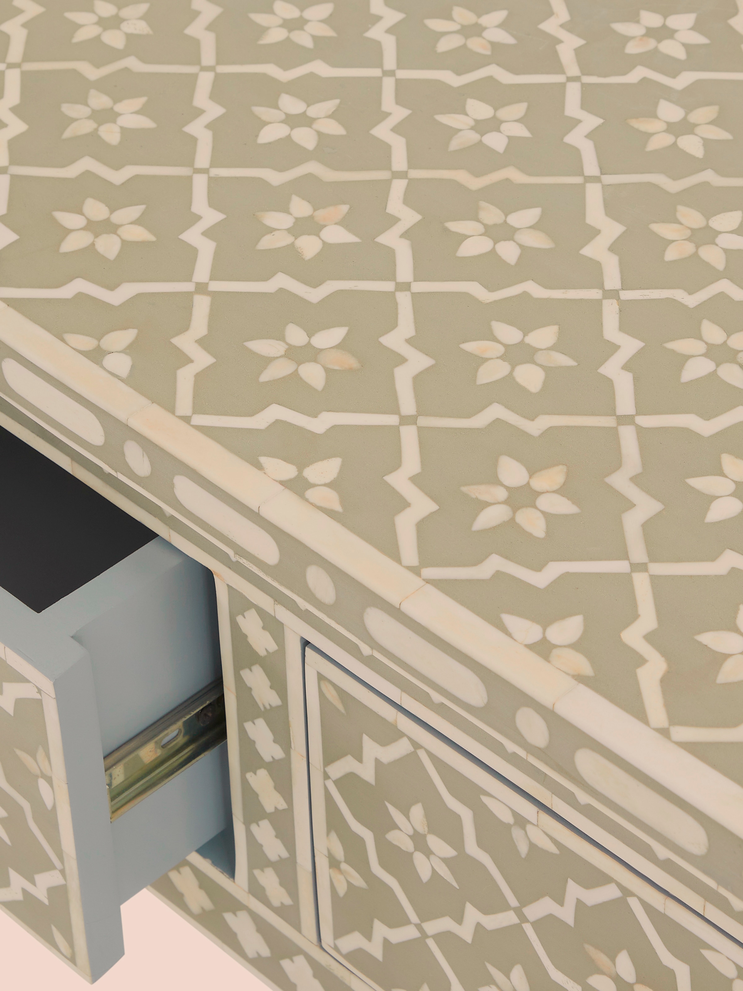 Detailed view of the bone inlay on the console table with focus on intricate patterns