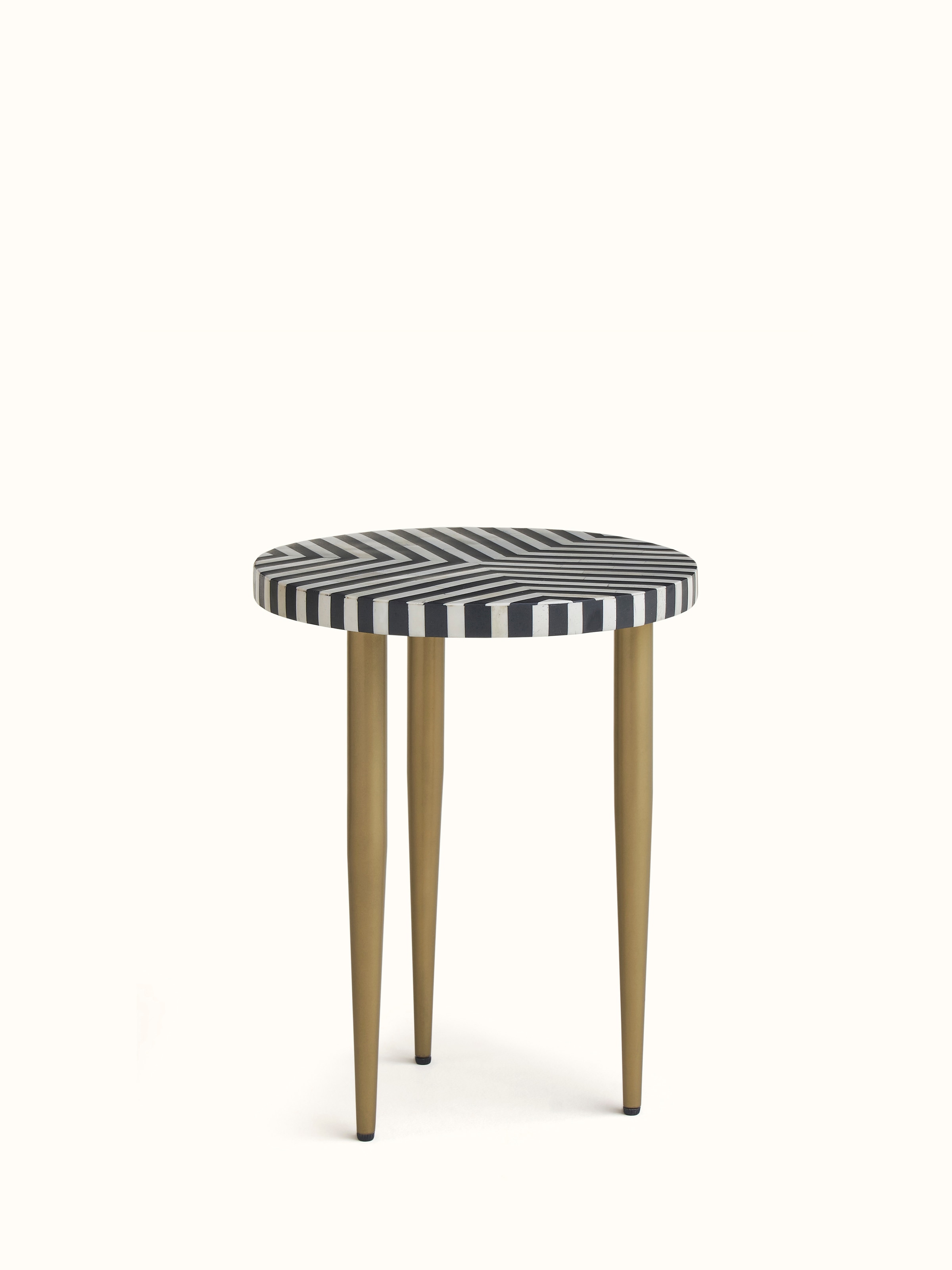 Angled view of the nesting tables showing the bone inlay pattern and table legs