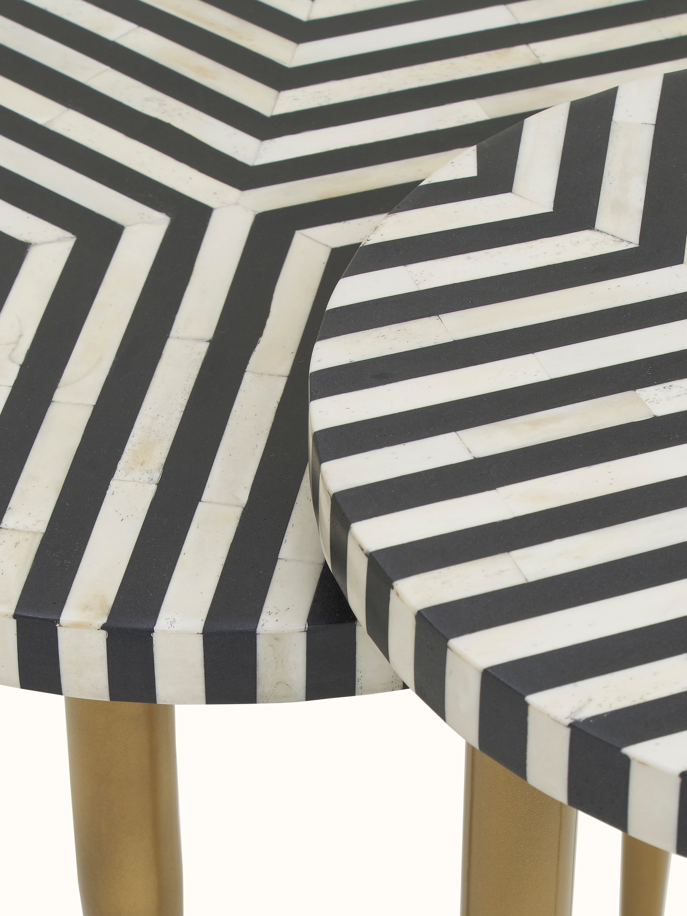 Detailed view of the nesting table's bone inlay and surface texture