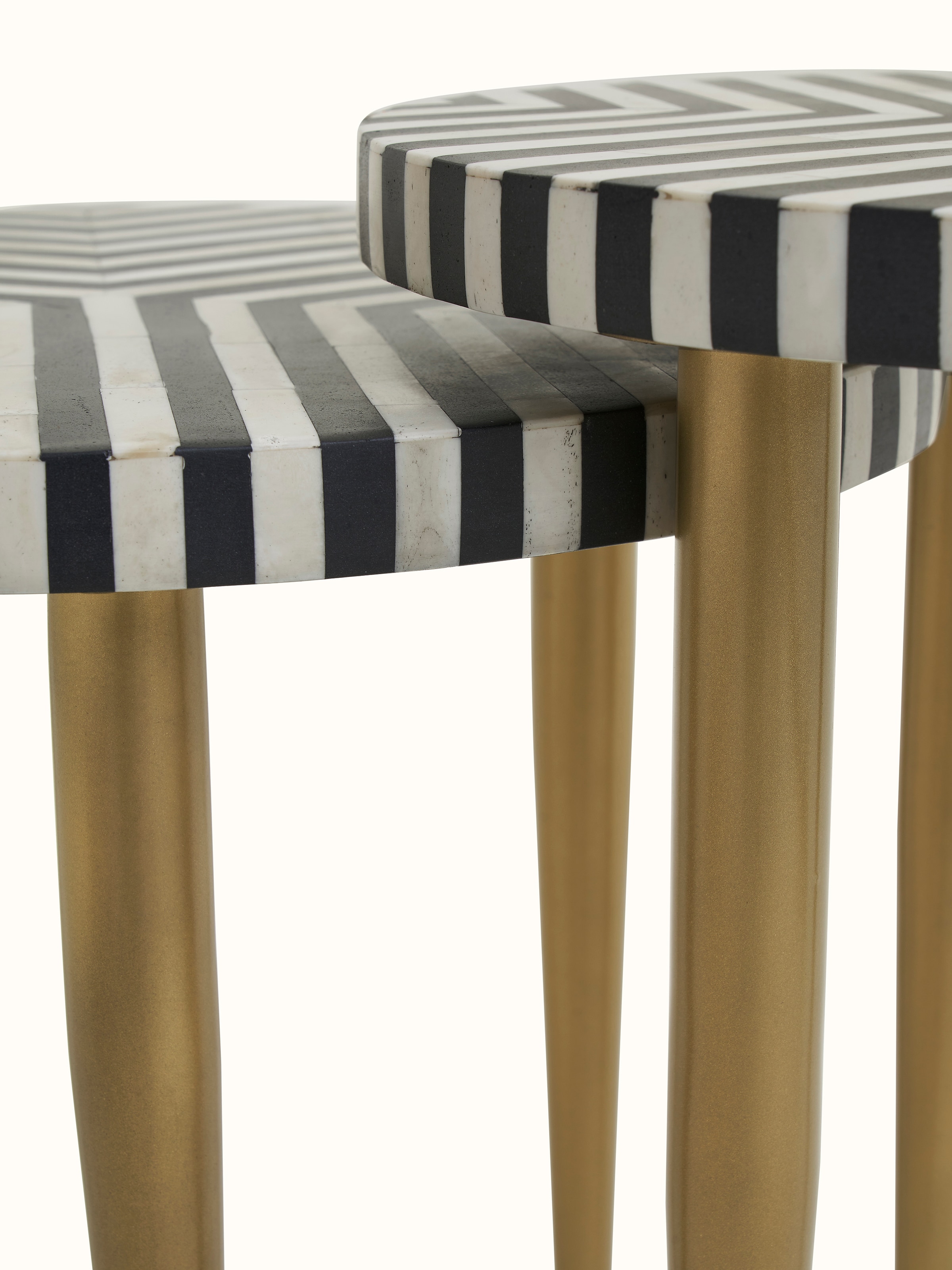 View of the nesting tables stacked, showcasing the versatility and design of the bone inlay
