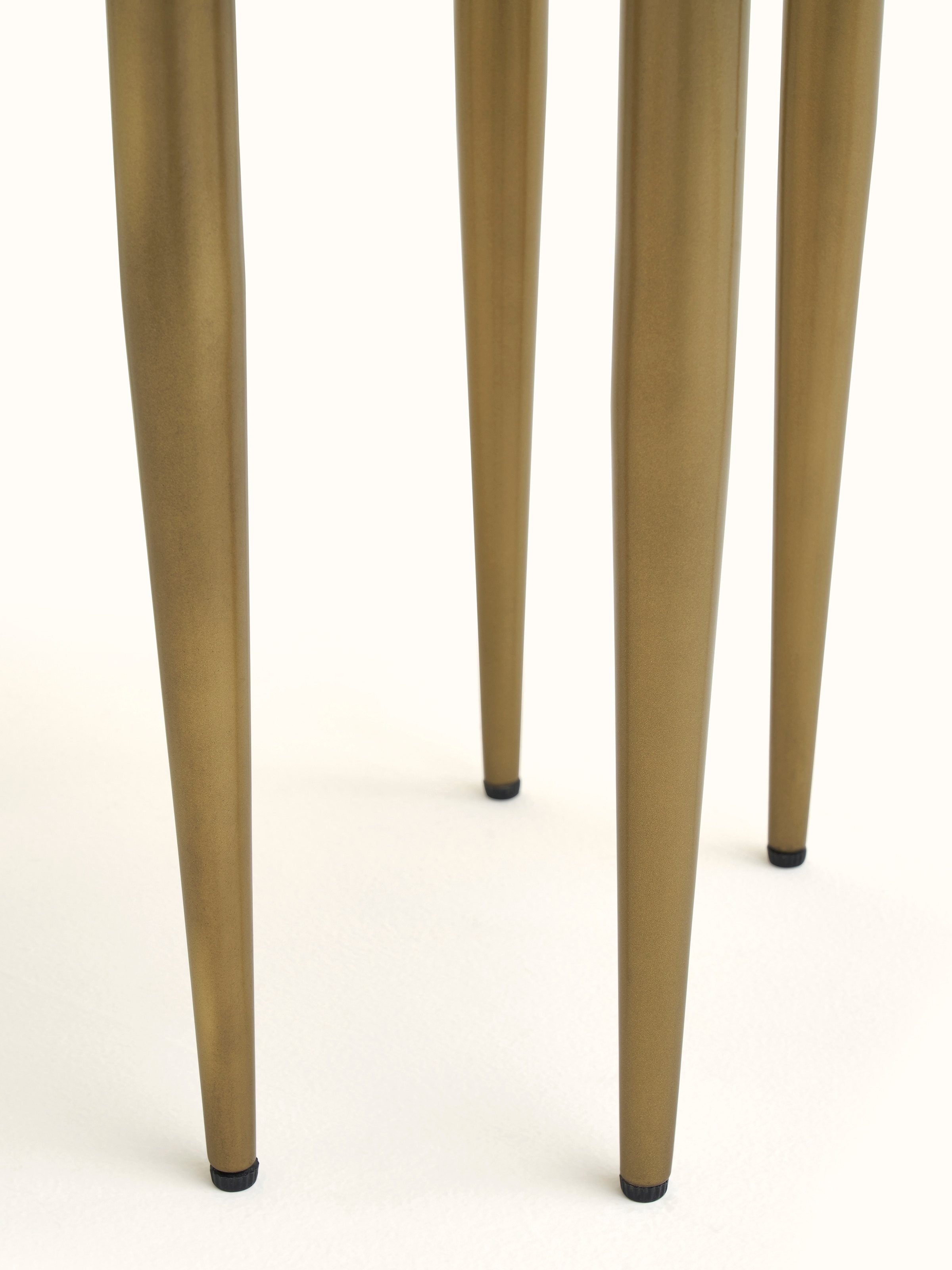 Side view of the nesting tables demonstrating the detailed bone inlay design and structure