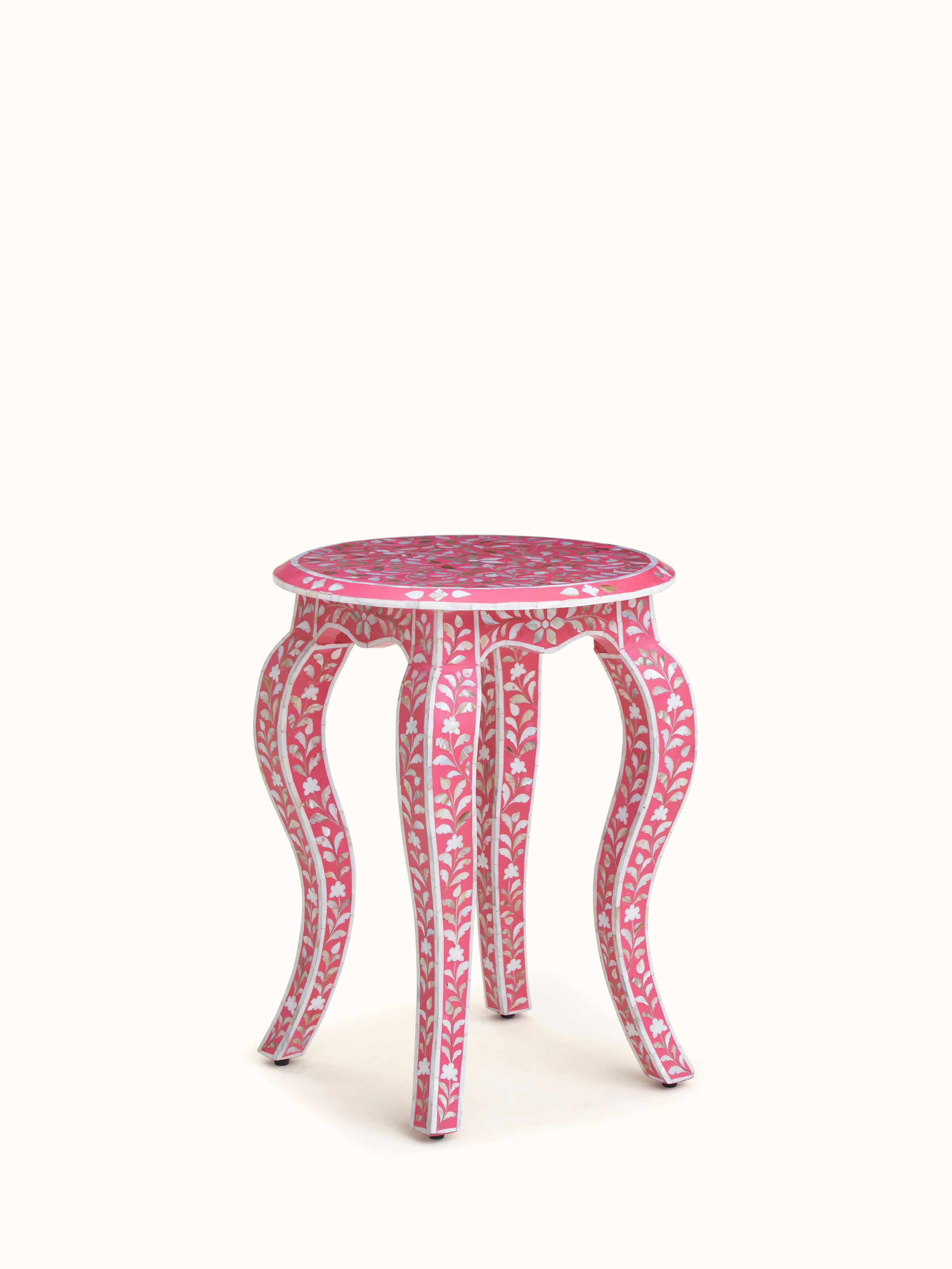 View of the mother-of-pearl inlaid side table with a focus on the overall inlay design and surface details