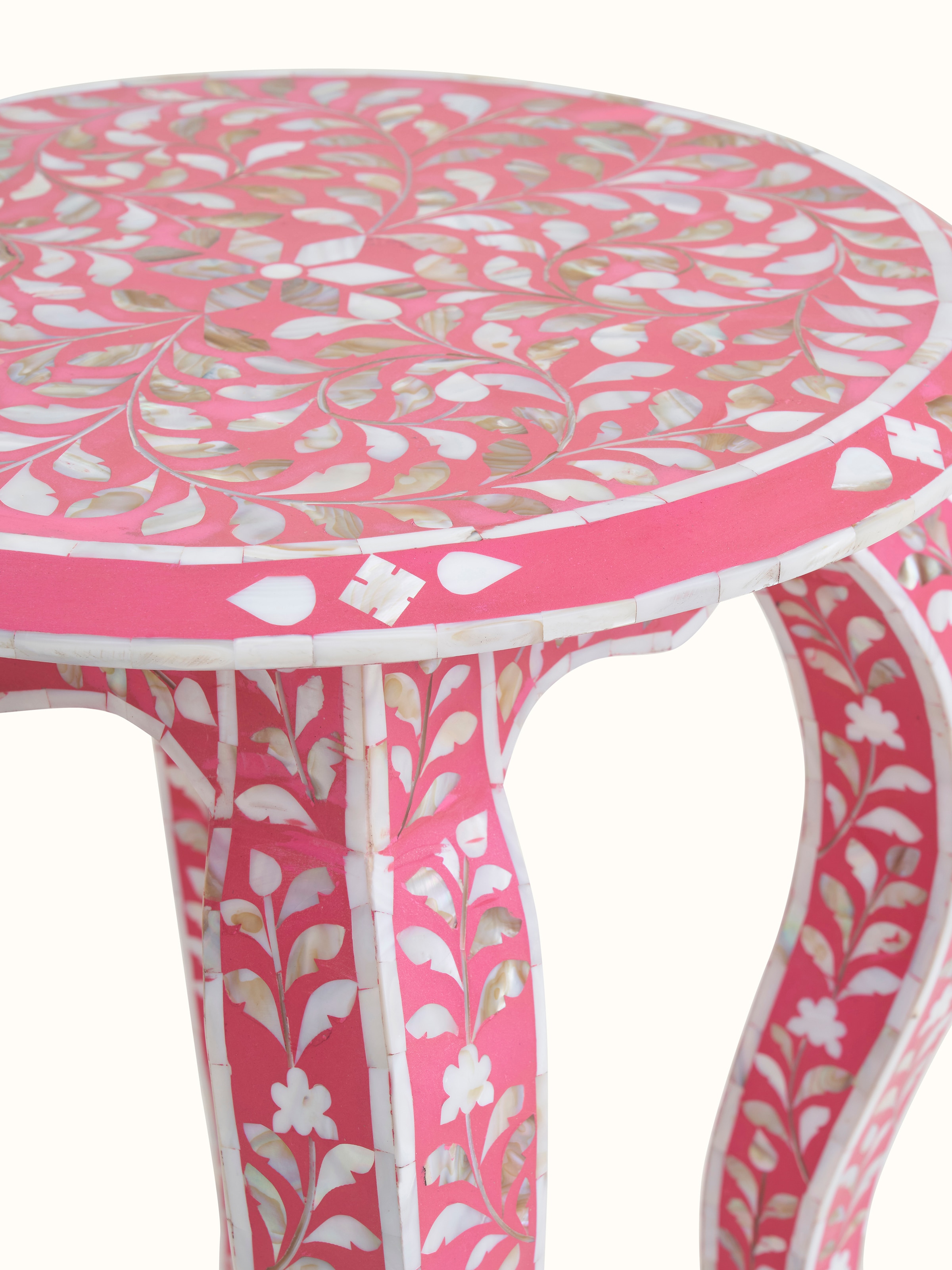Detailed view of the base and legs of the mother-of-pearl inlaid side table, showcasing the craftsmanship and materials used