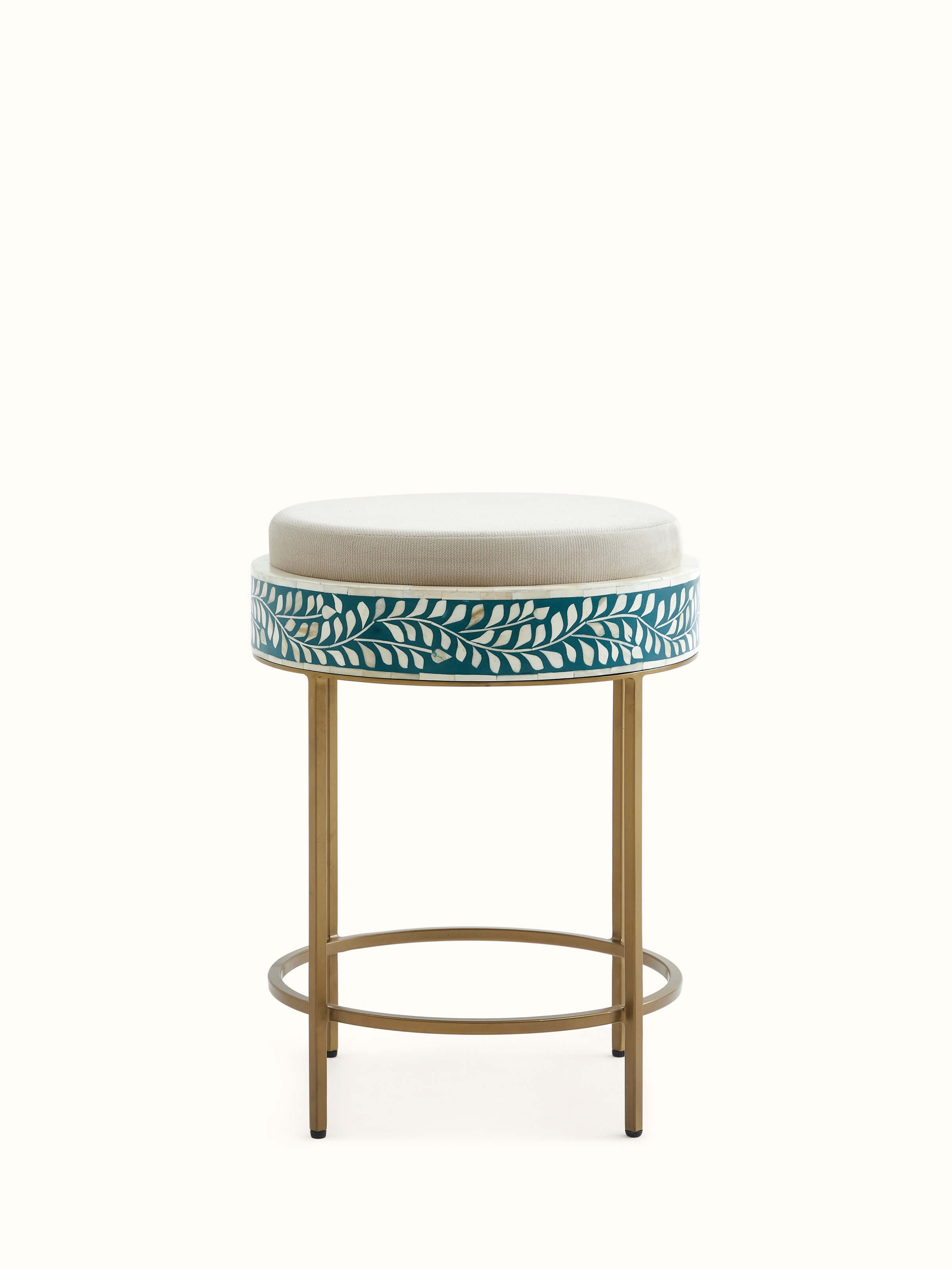 Upholstered metal stool with intricate bone inlay design, showcasing a unique blend of materials and craftsmanship.