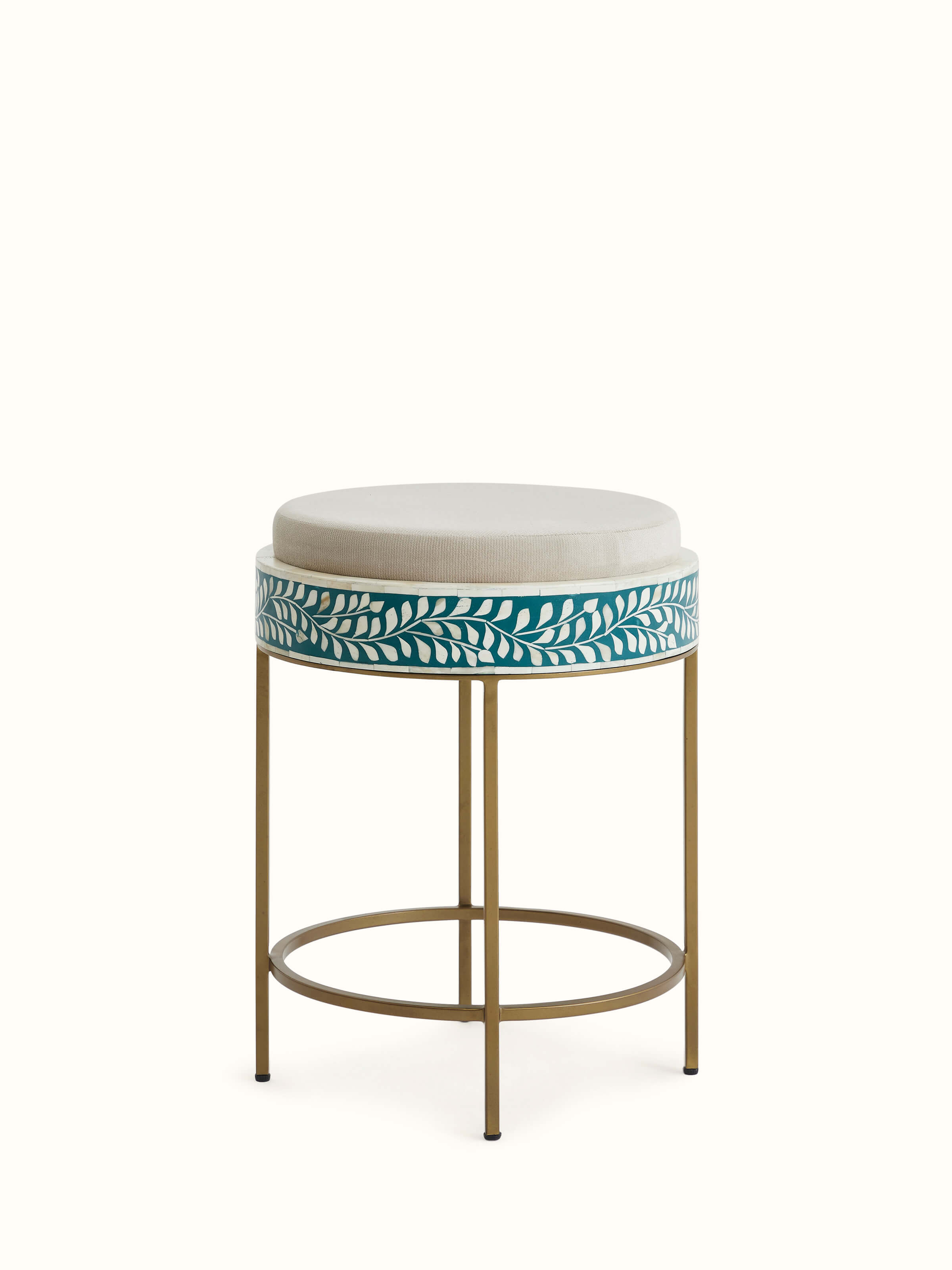 Close-up of the bone inlay on the upholstered metal stool, showcasing the intricate patterns and high-quality finish.