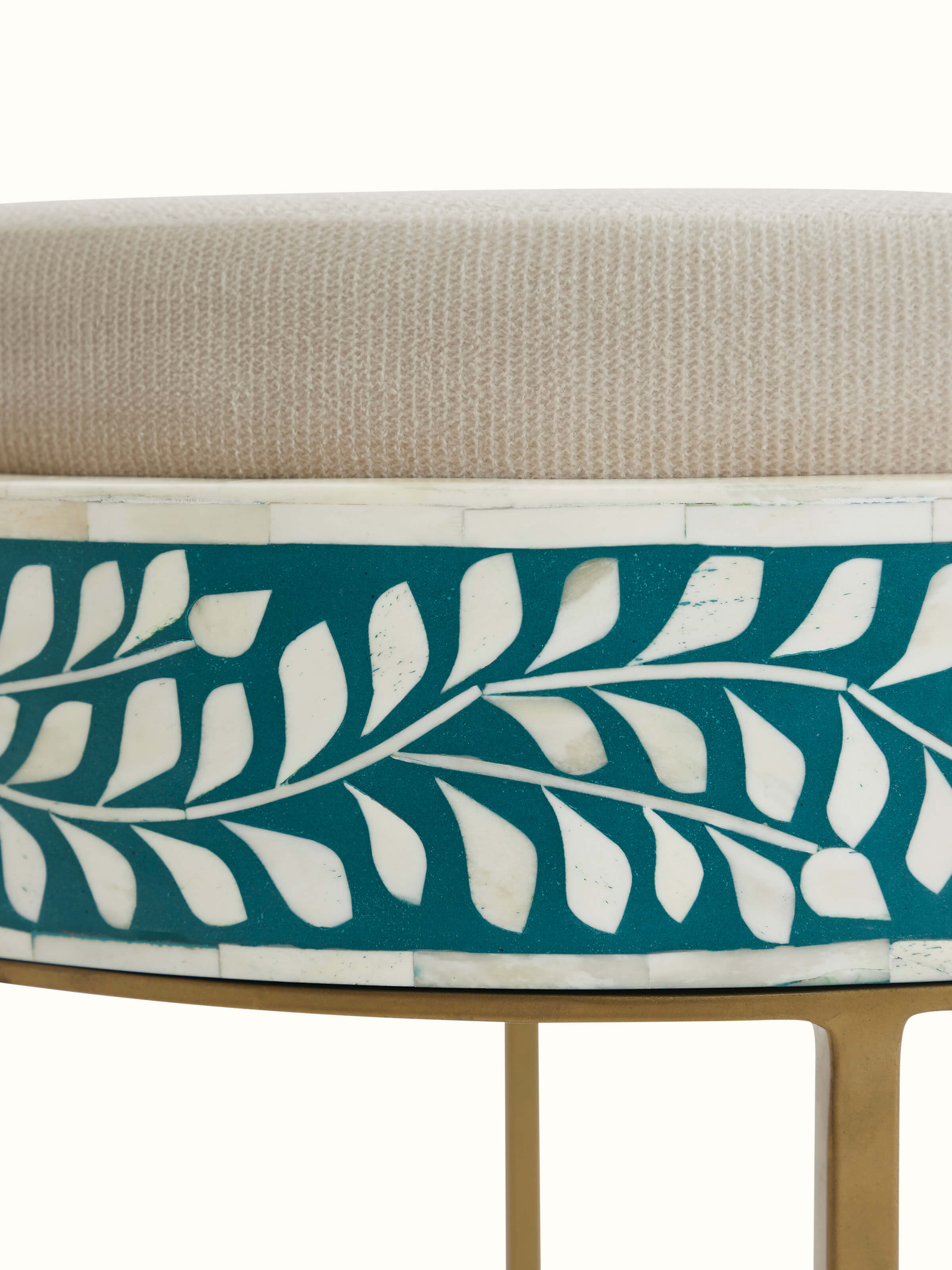 Another angle of the upholstered metal stool with bone inlay, emphasizing its stylish design and functional elegance.