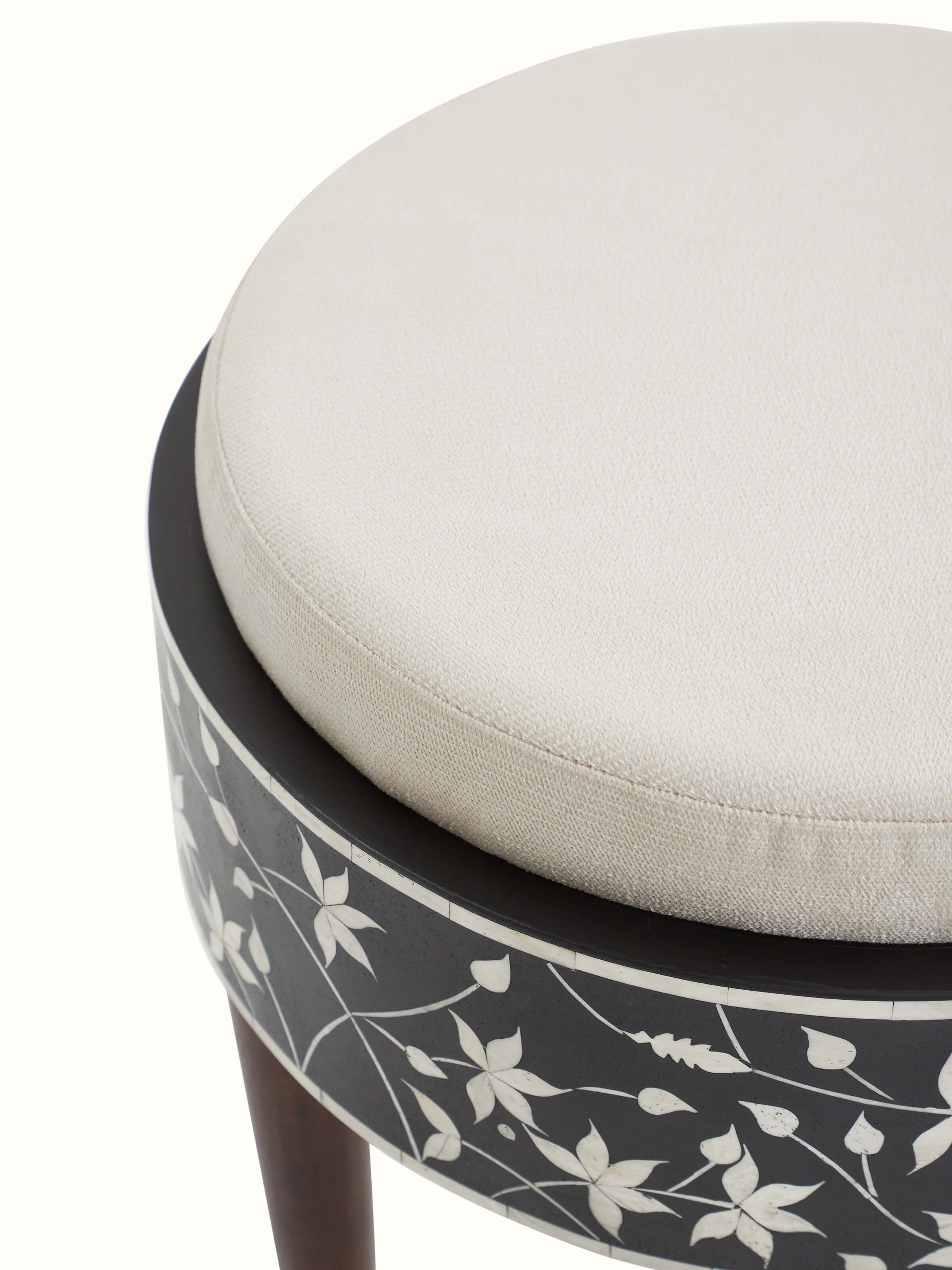 Top view of bone inlaid Sheesham wood stool, showcasing the intricate inlay pattern on the seating surface.