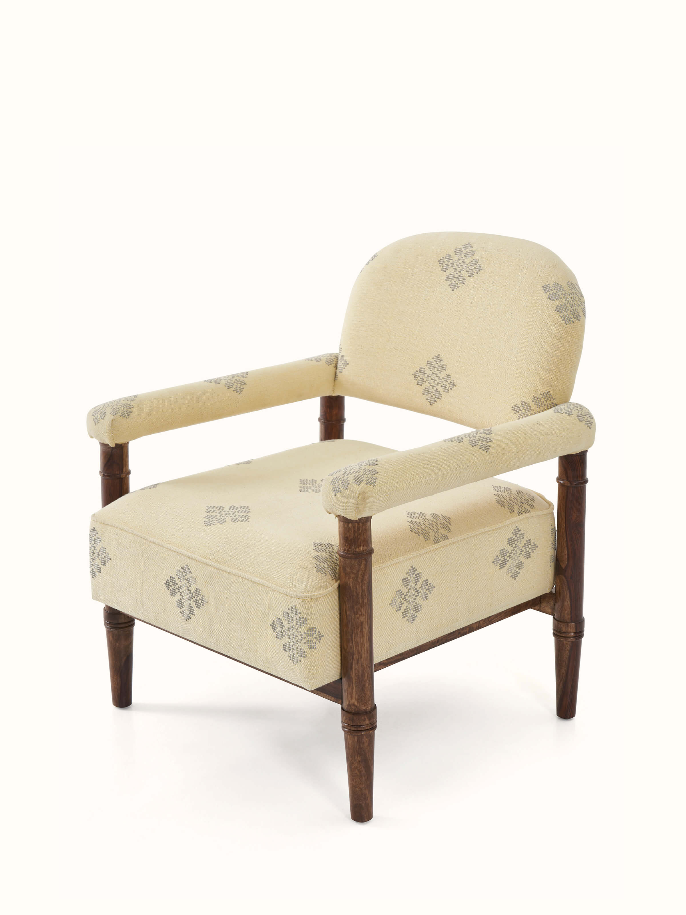 Close-up of the upholstery detail on the sheesham wood Bawan Buti armchair