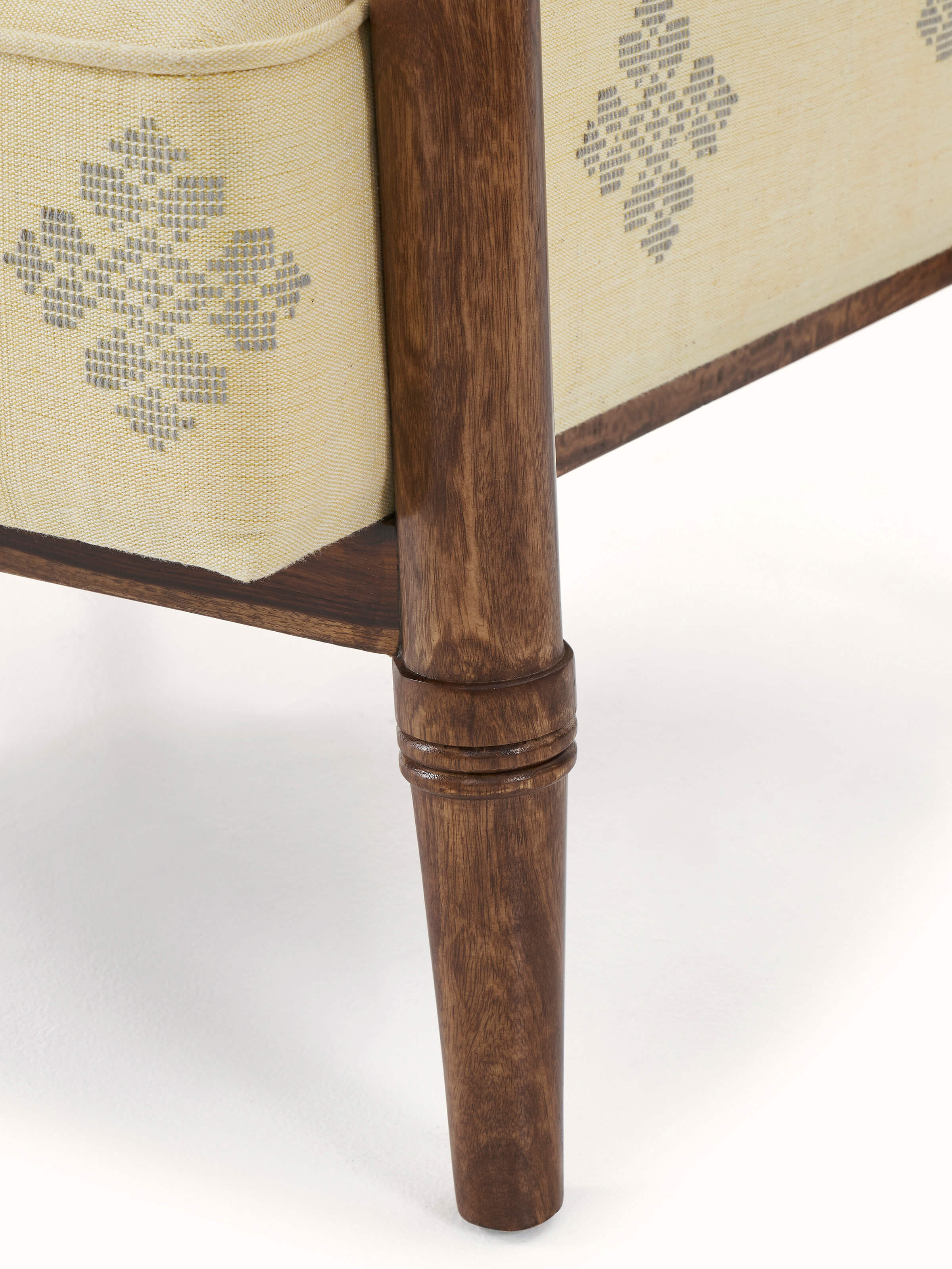 Back view highlighting the craftsmanship and design of the sheesham wood Bawan Buti armchair
