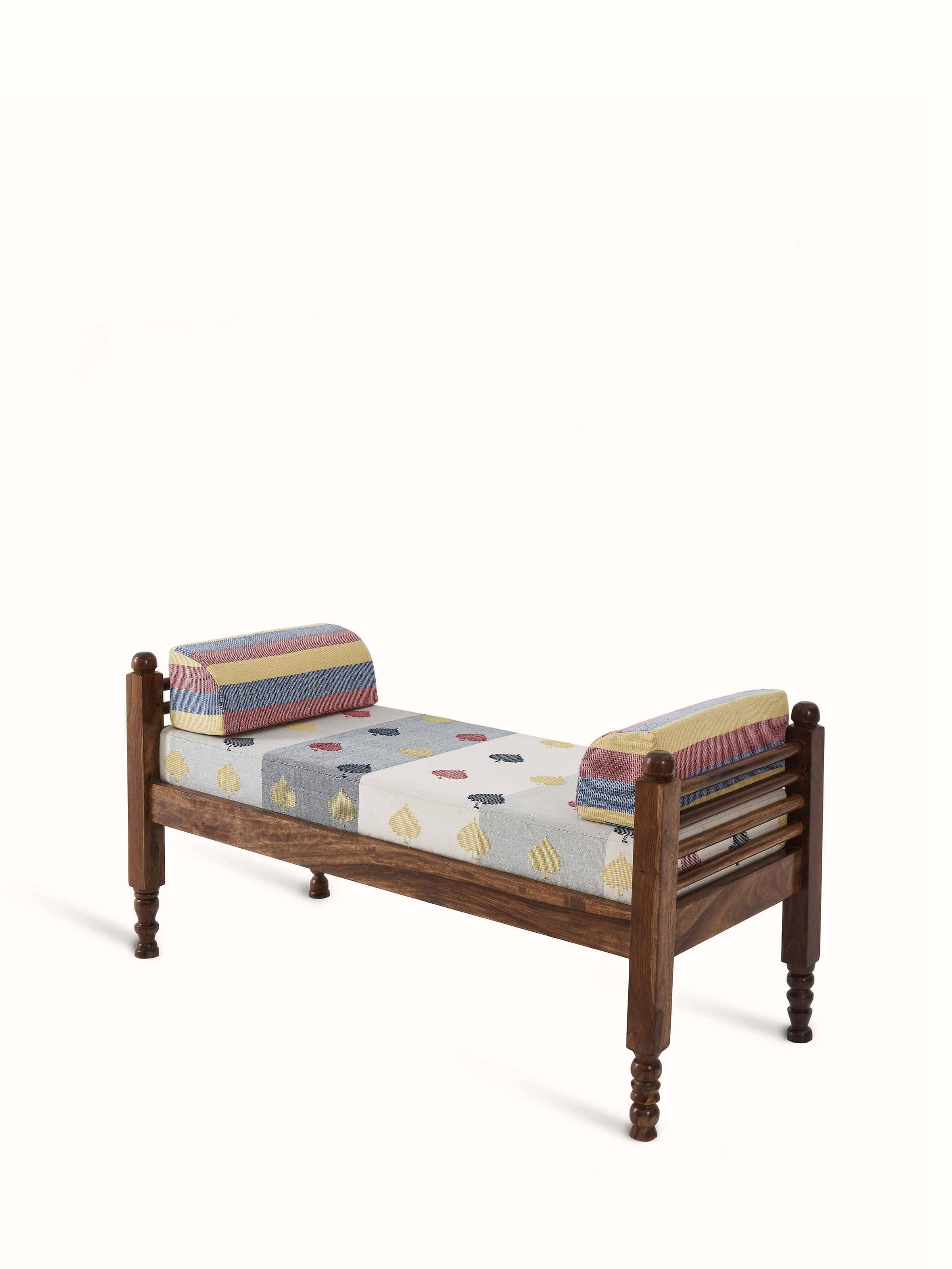 Close-up of the Bawan buti upholstery on the sheesham wood 2-seater bench, showcasing the detailed patterns and high-quality fabric.