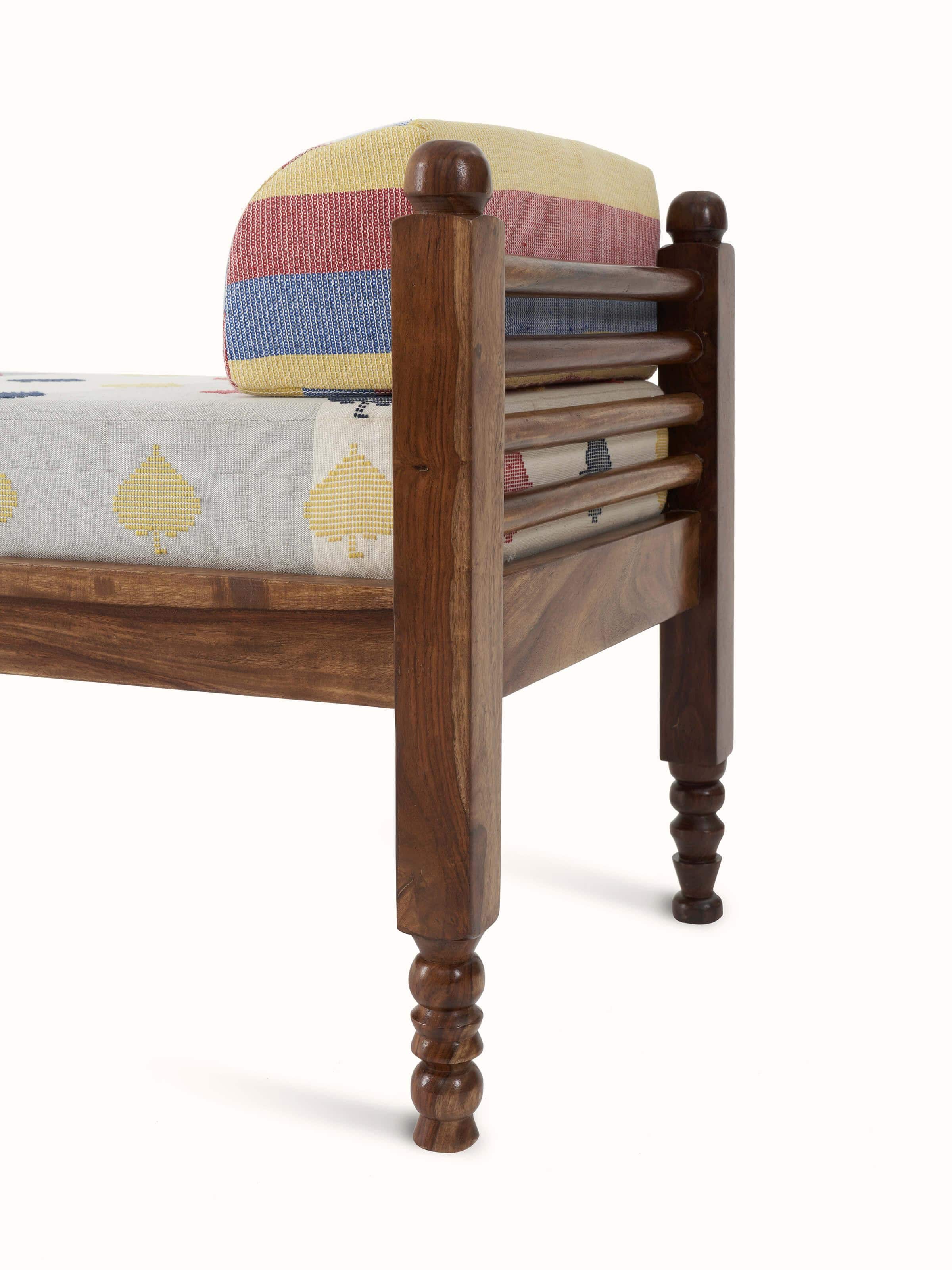 Detailed view of the sheesham wood frame and Bawan buti upholstery on the 2-seater bench, showcasing its artistic design.