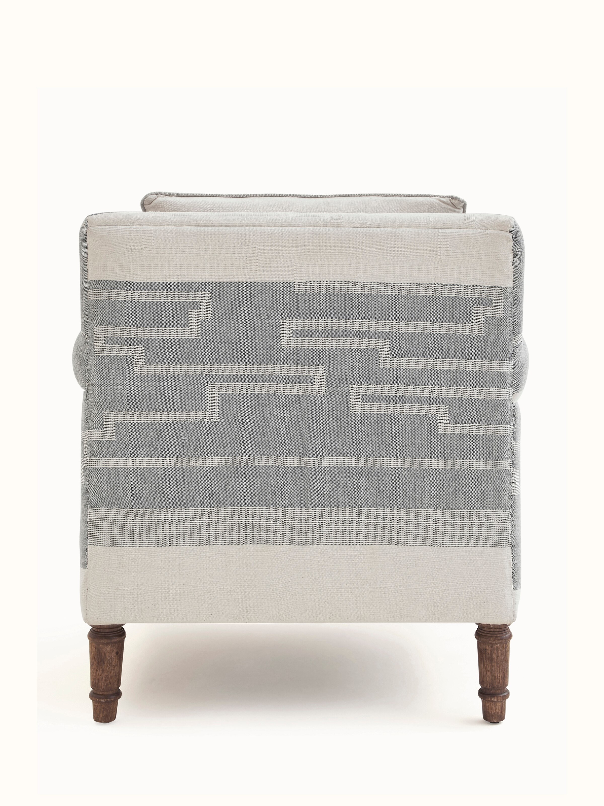 Close-up of the Sheesham Wood Bawan Buti Lounge Chair's unique carving details and traditional aesthetic