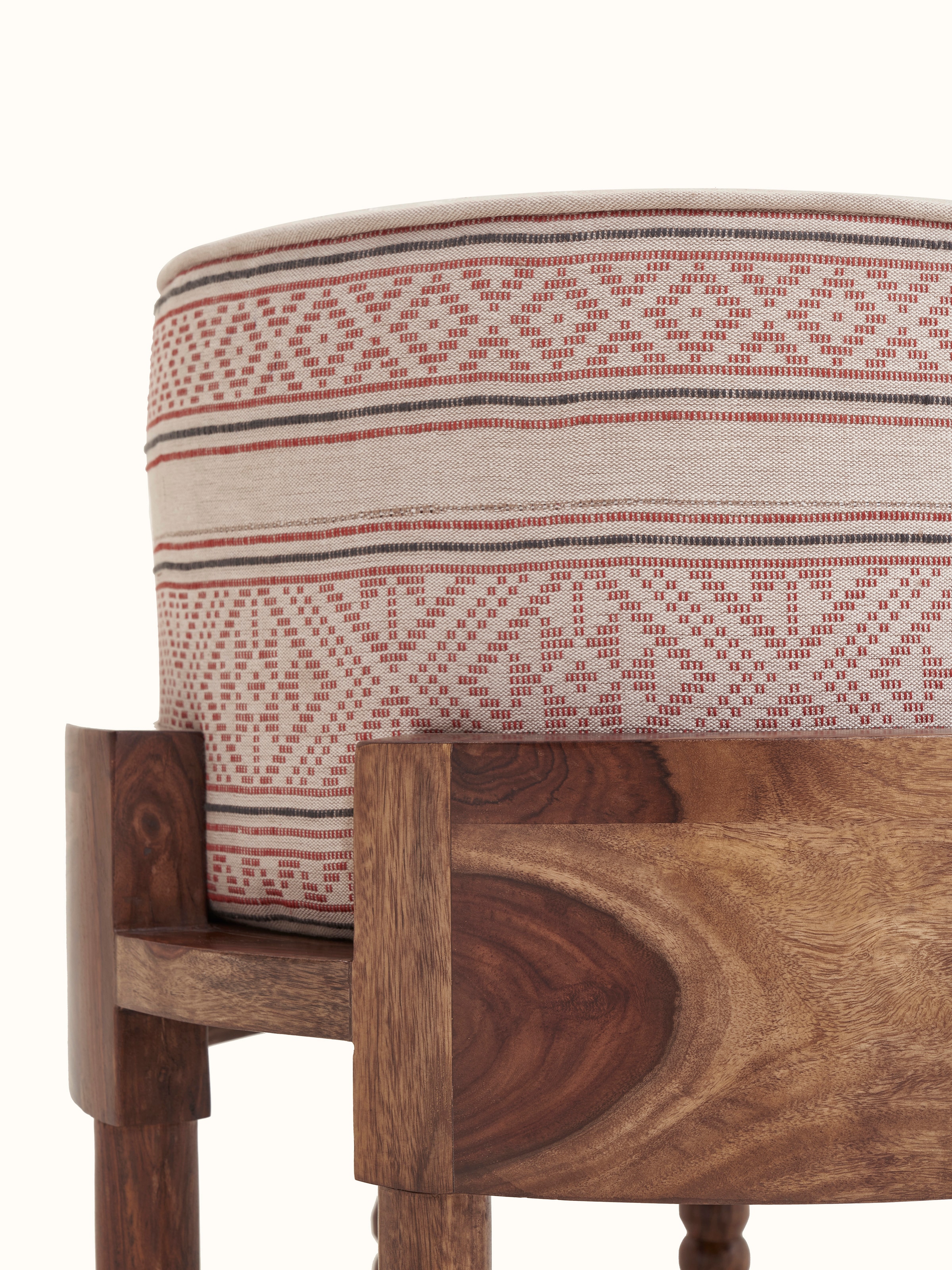 Bottom view of Bawan Buti upholstered Sheesham wood ottoman showing its base and construction