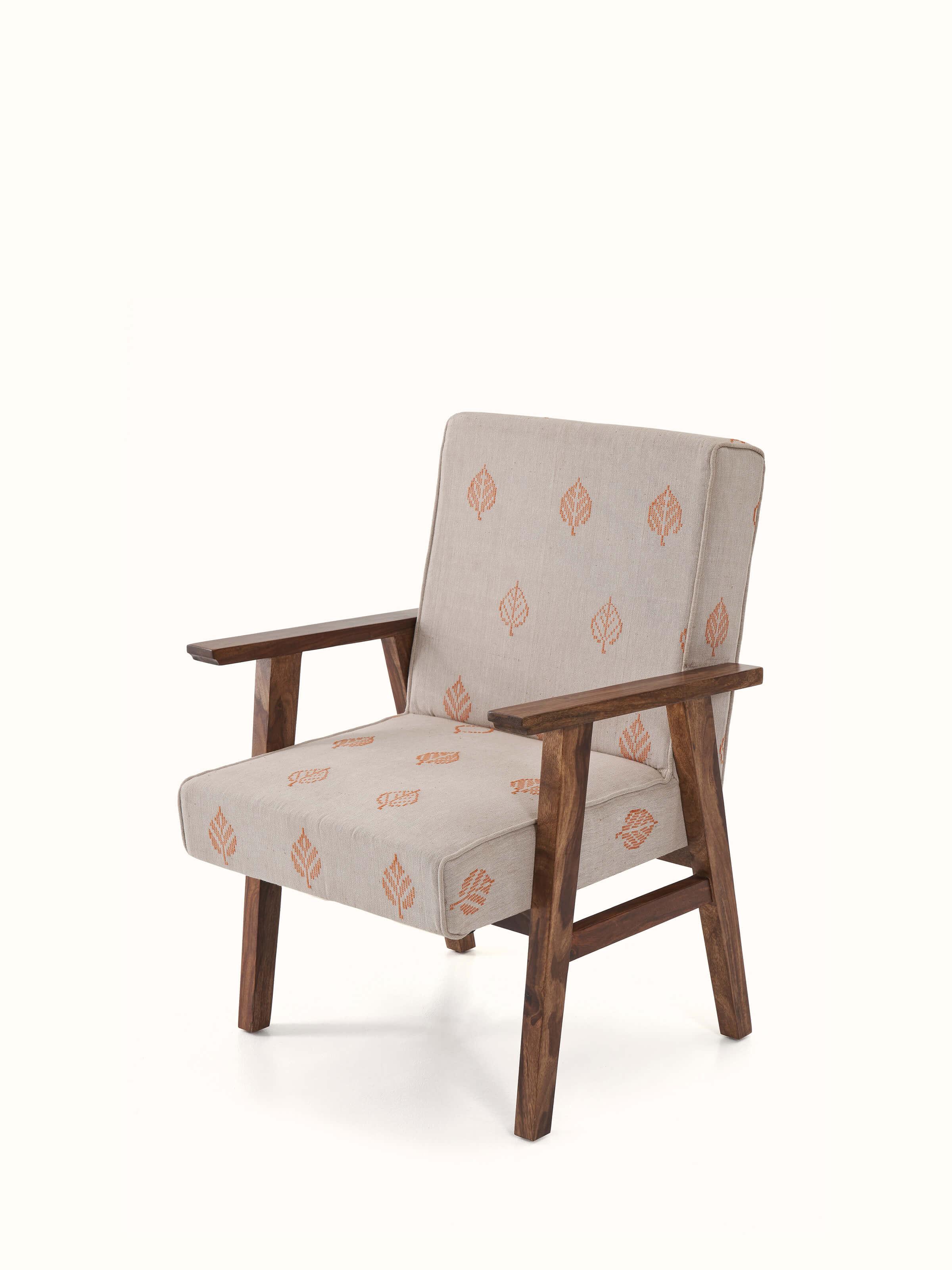 Angled view of the Bawan Buti upholstered study chair, emphasizing the intricate upholstery and sturdy Sheesham wood.