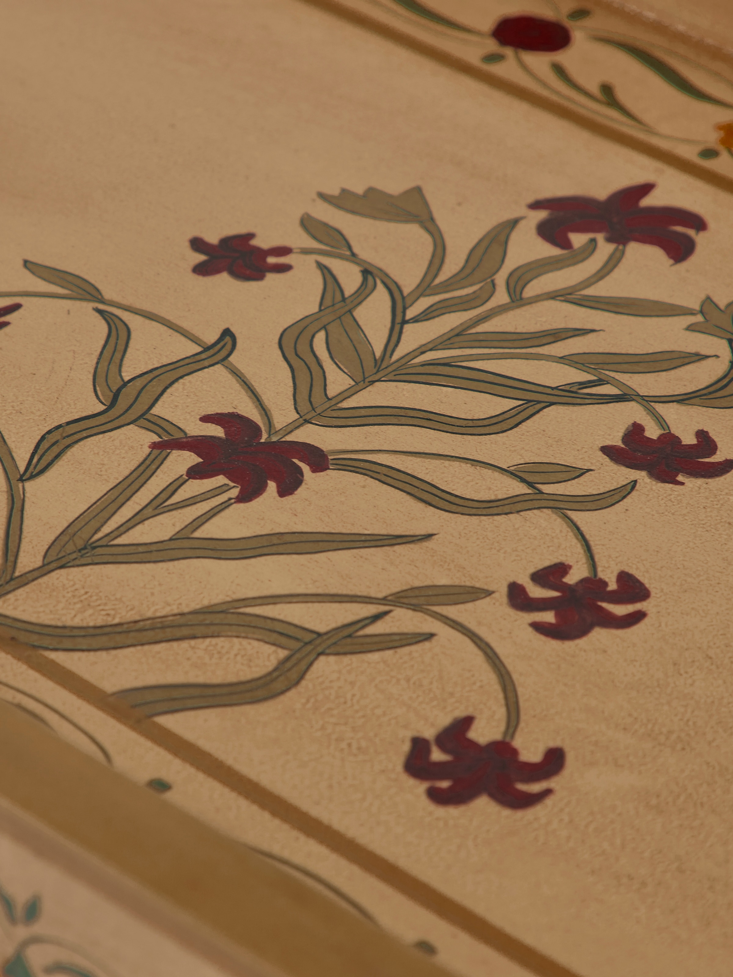 Close-up view of miniature painted portable table highlighting the craftsmanship