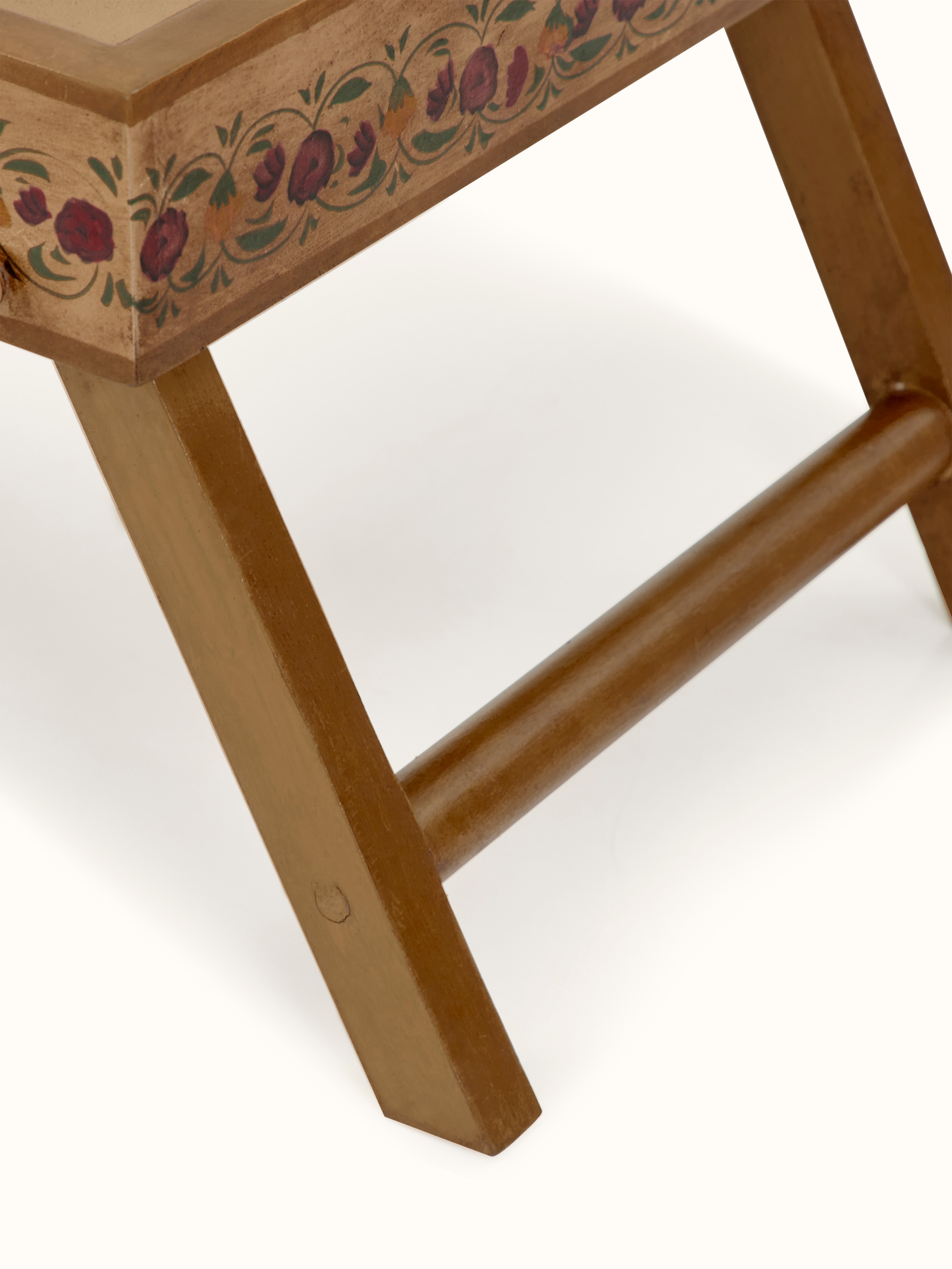 Top view of miniature painted portable table displaying the full design and artwork