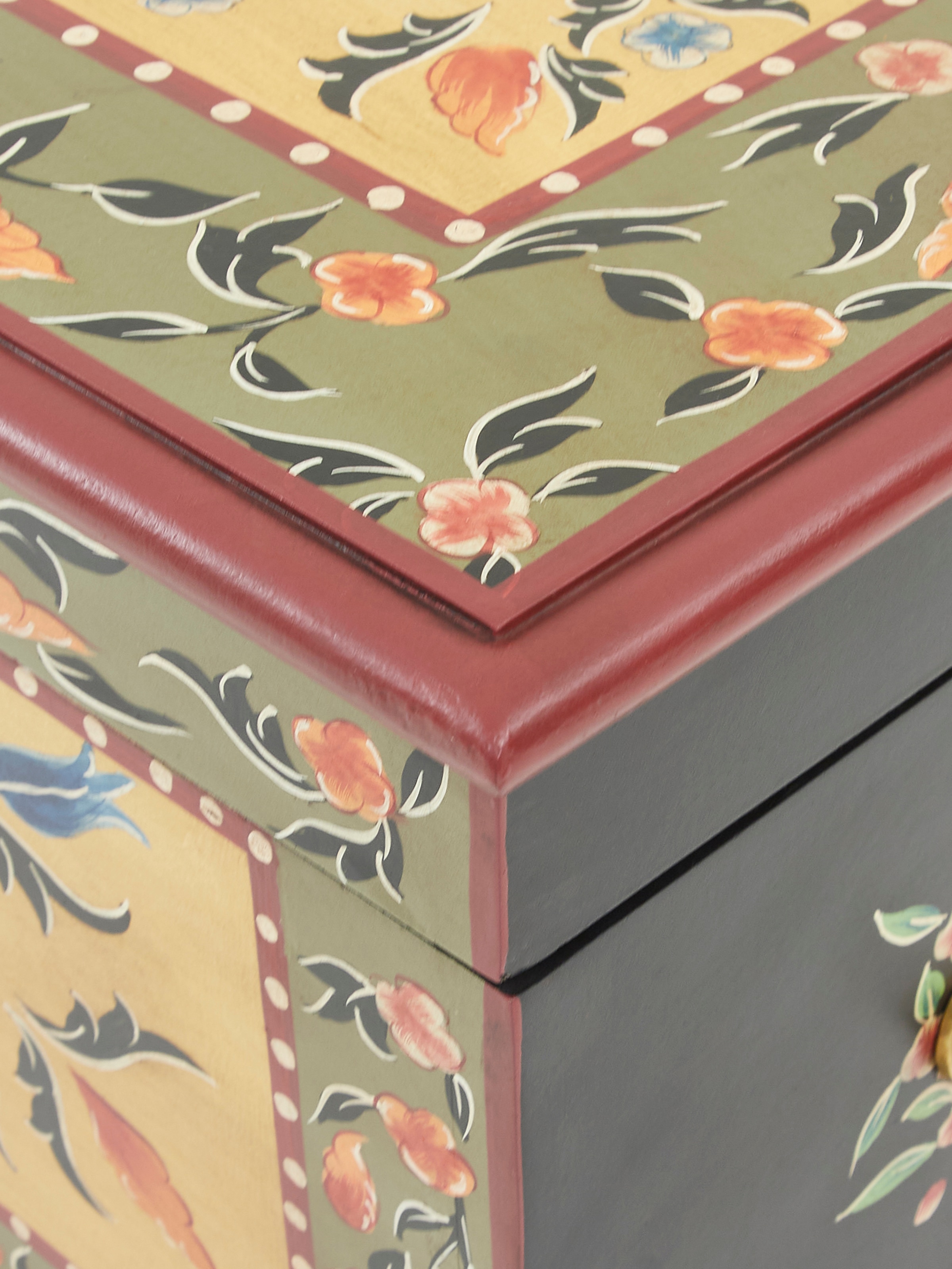 Detailed close-up of Miniature Painted Trunk’s painted surface, emphasizing the artistic design