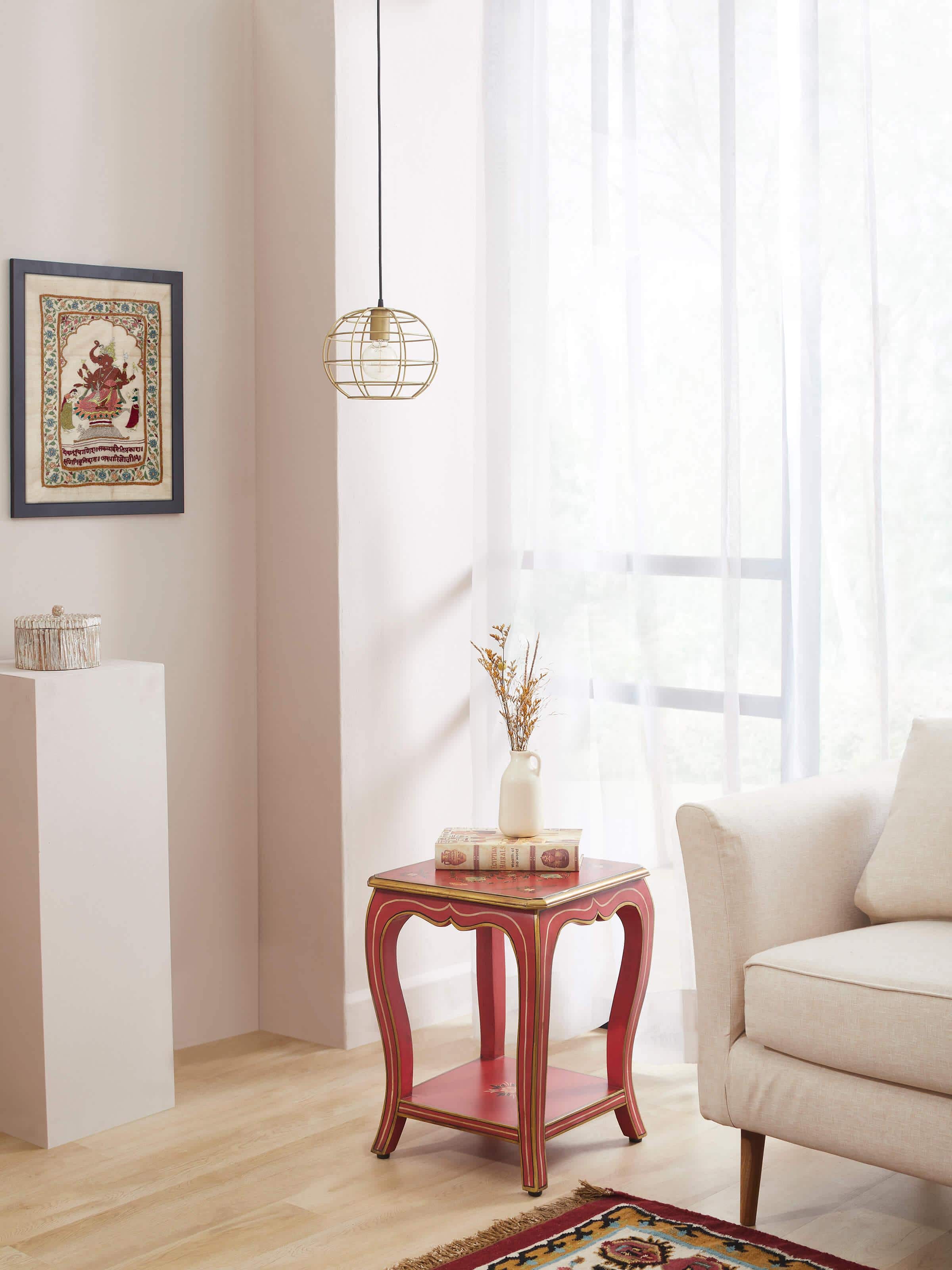 Side view of the mango wood miniature painted end & side table, highlighting the detailed painting and craftsmanship