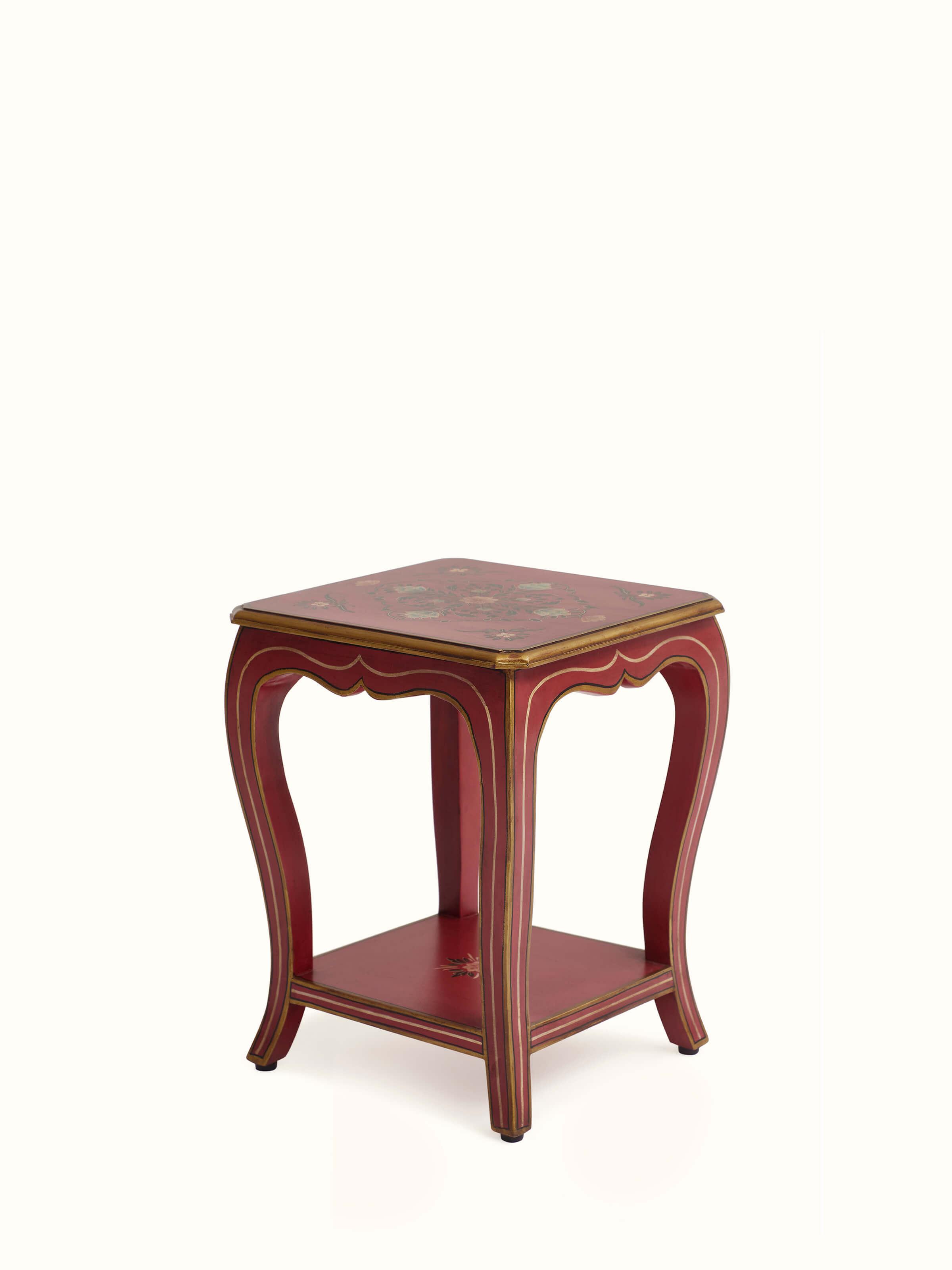 Close-up of the painted surface on the mango wood end & side table, displaying the artistic patterns and color details