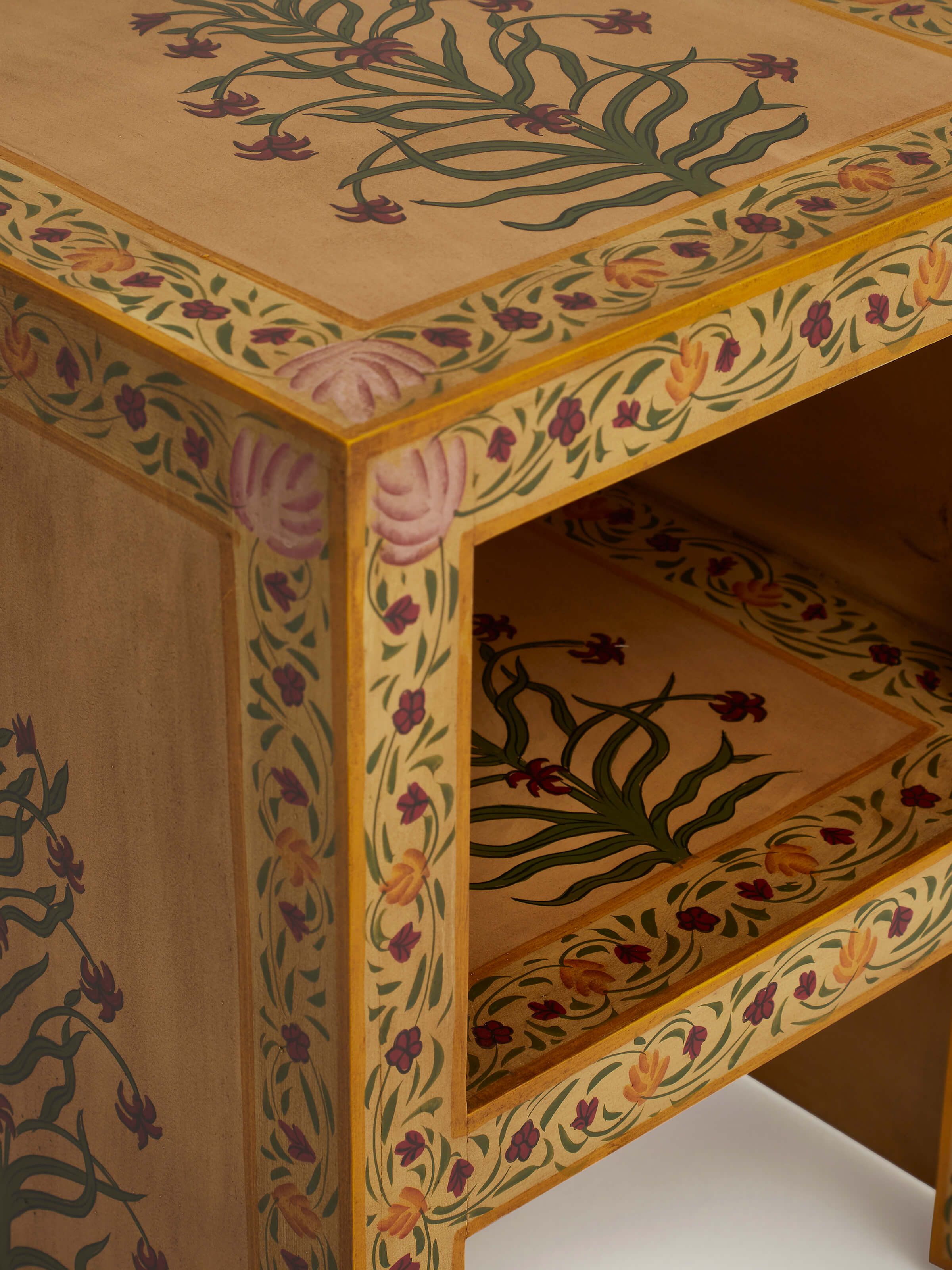 Detailed shot of miniature painted end table, focusing on the vibrant colors and hand-painted artistry.