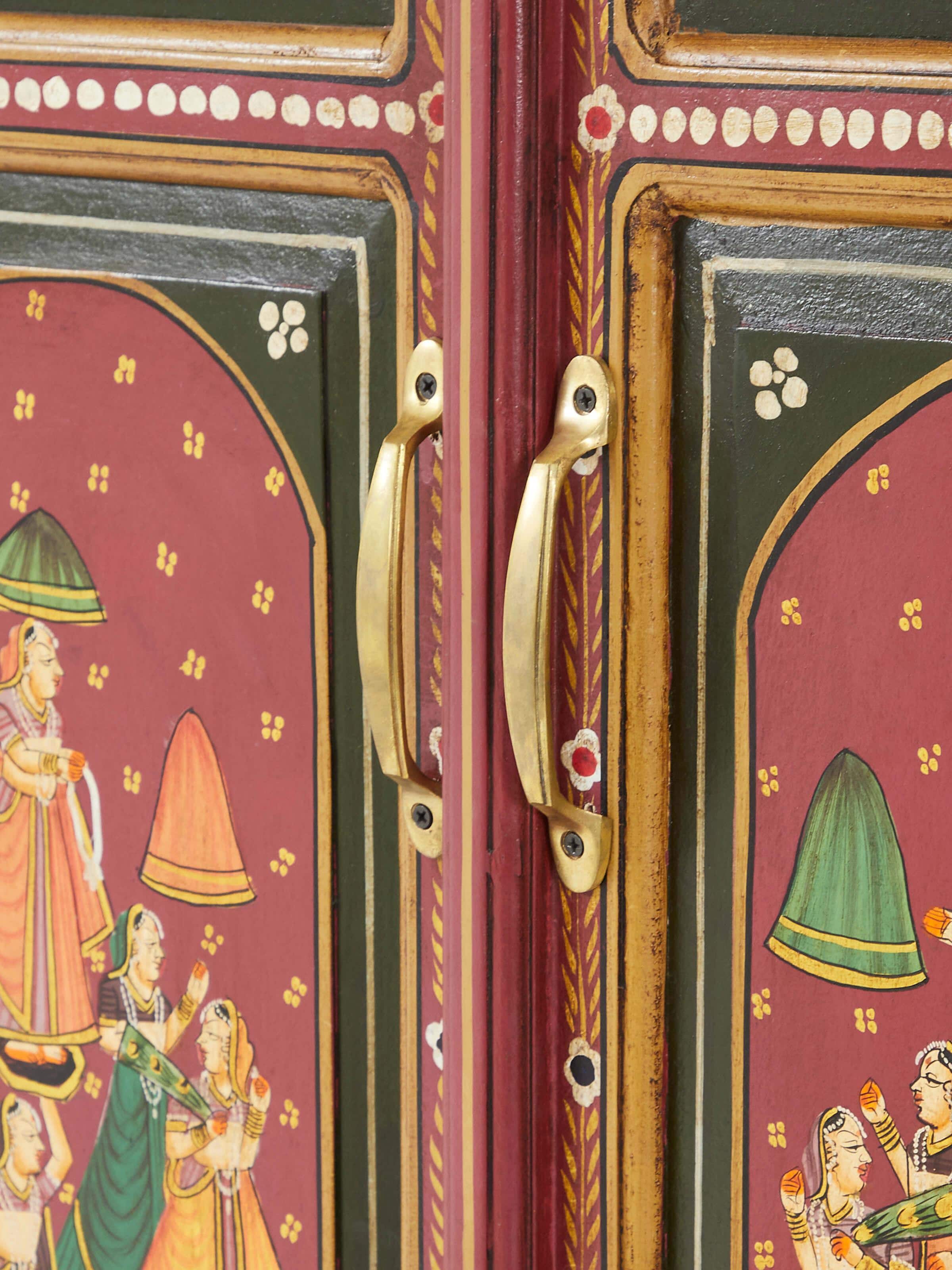 Side angle of the miniature painted wardrobe, displaying the full height and decorative details.